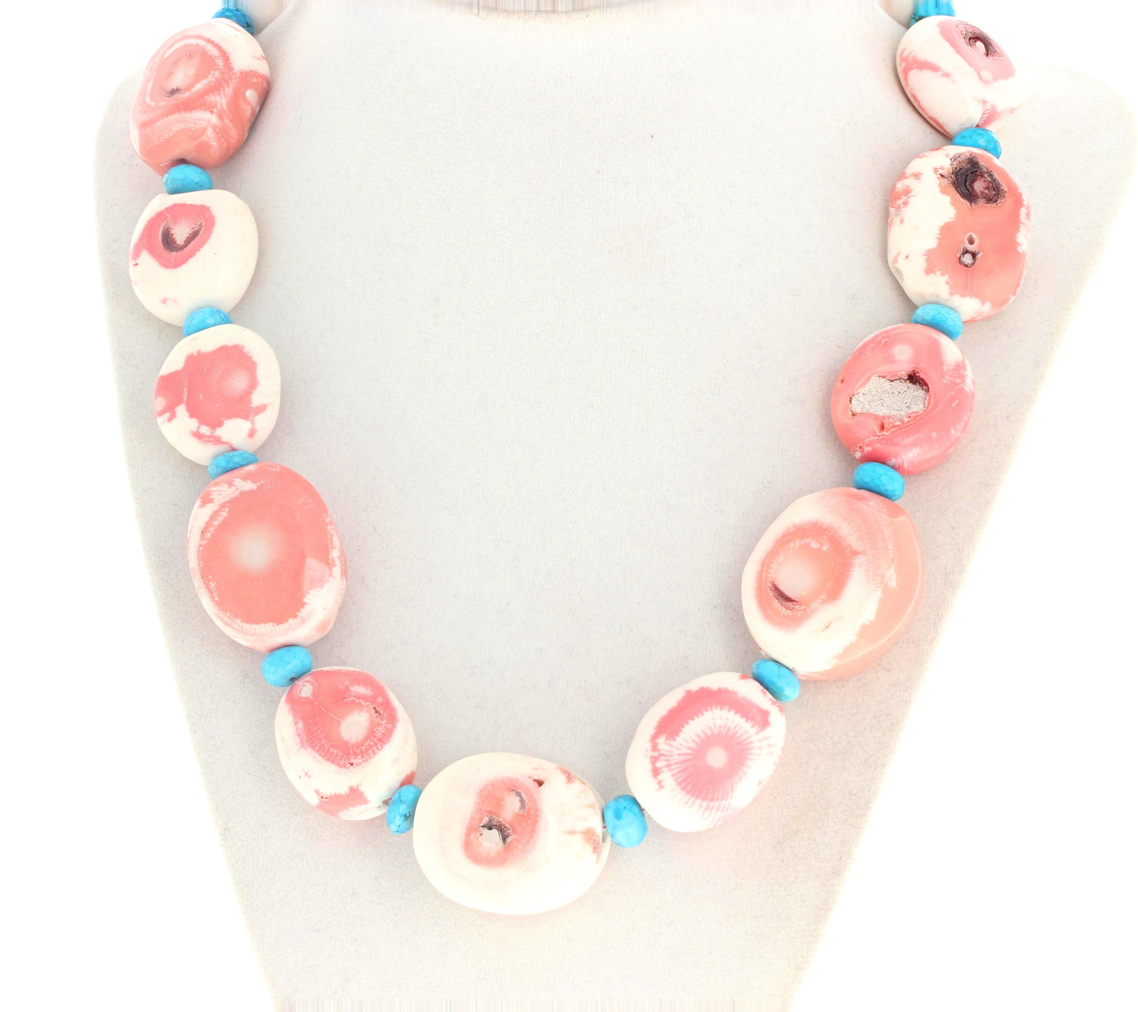 Fascinating dramatic huge highly polished natural pink Turquoise are enhanced by these highly polished rondels of natural blue Turquoise in this 19 1/2 inch long necklace.  The largest Coral is approximately 30mm x 26 1/2mm.  The beautiful blue