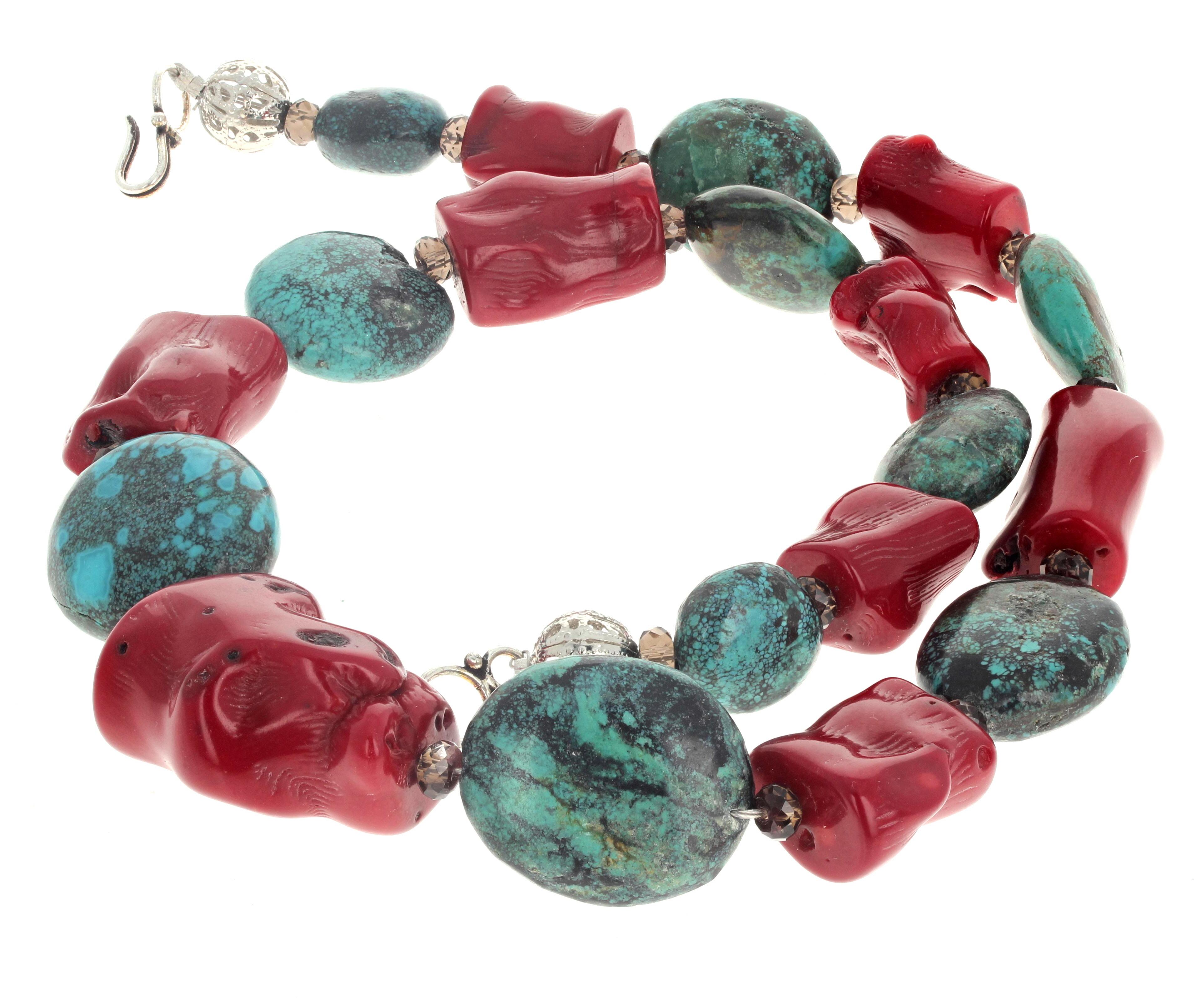 This 23 inch long beautiful artistic necklace is natural polished Turquoise and natural red Bamboo Coral enhanced with glittering brilliant Smoky Quartz.  The largest center Coral is 35mm x 24 1/2mm.  The easy to use hook clasp is silver.  