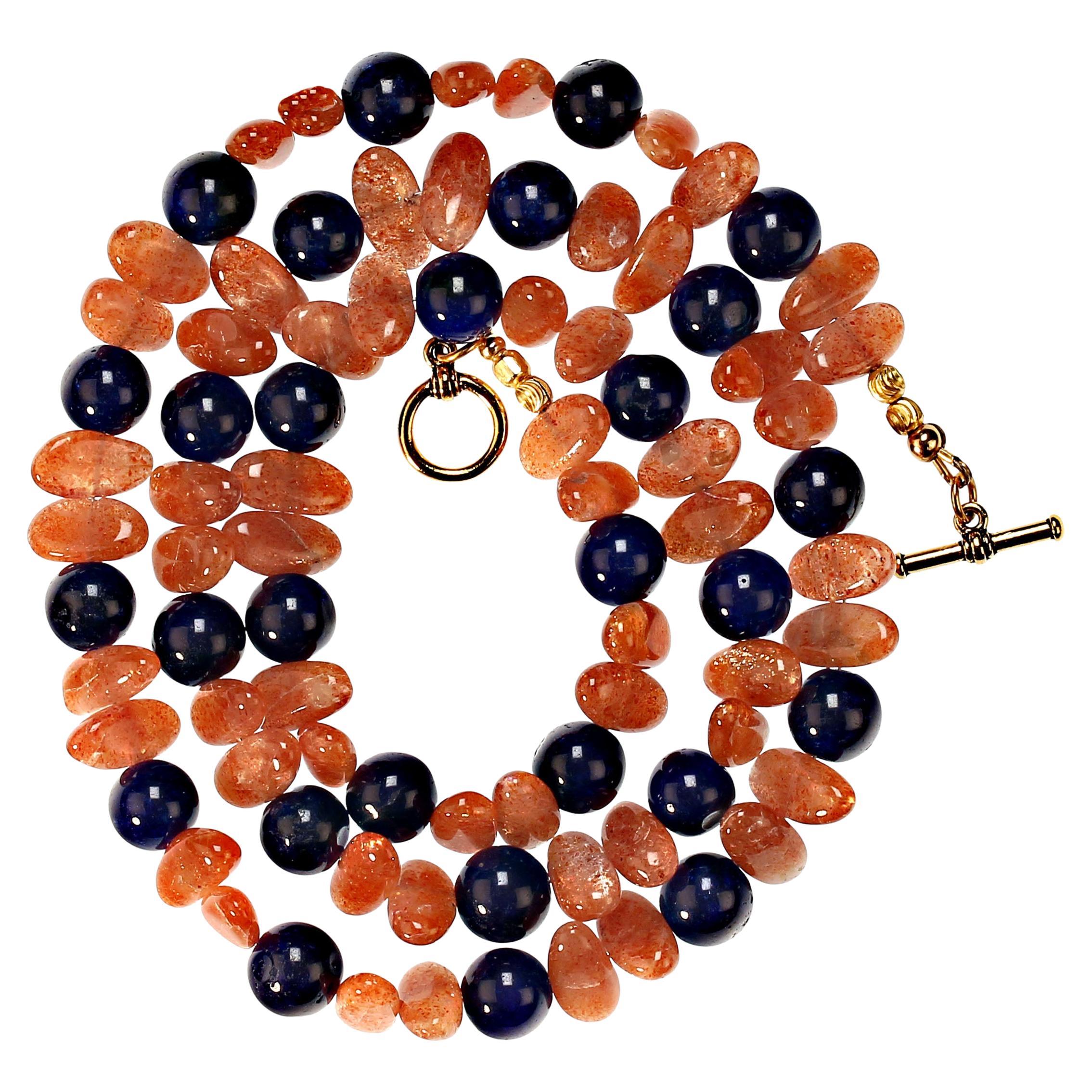Glittering Sunstone is such fun to wear! This necklace sparkles and glimmers and then it moves! Wear this 28 inch necklace of Sunstone and dyed Blue Agate to enhance all your blue, beige, black, and white. It's the perfect lightweight necklace of 28