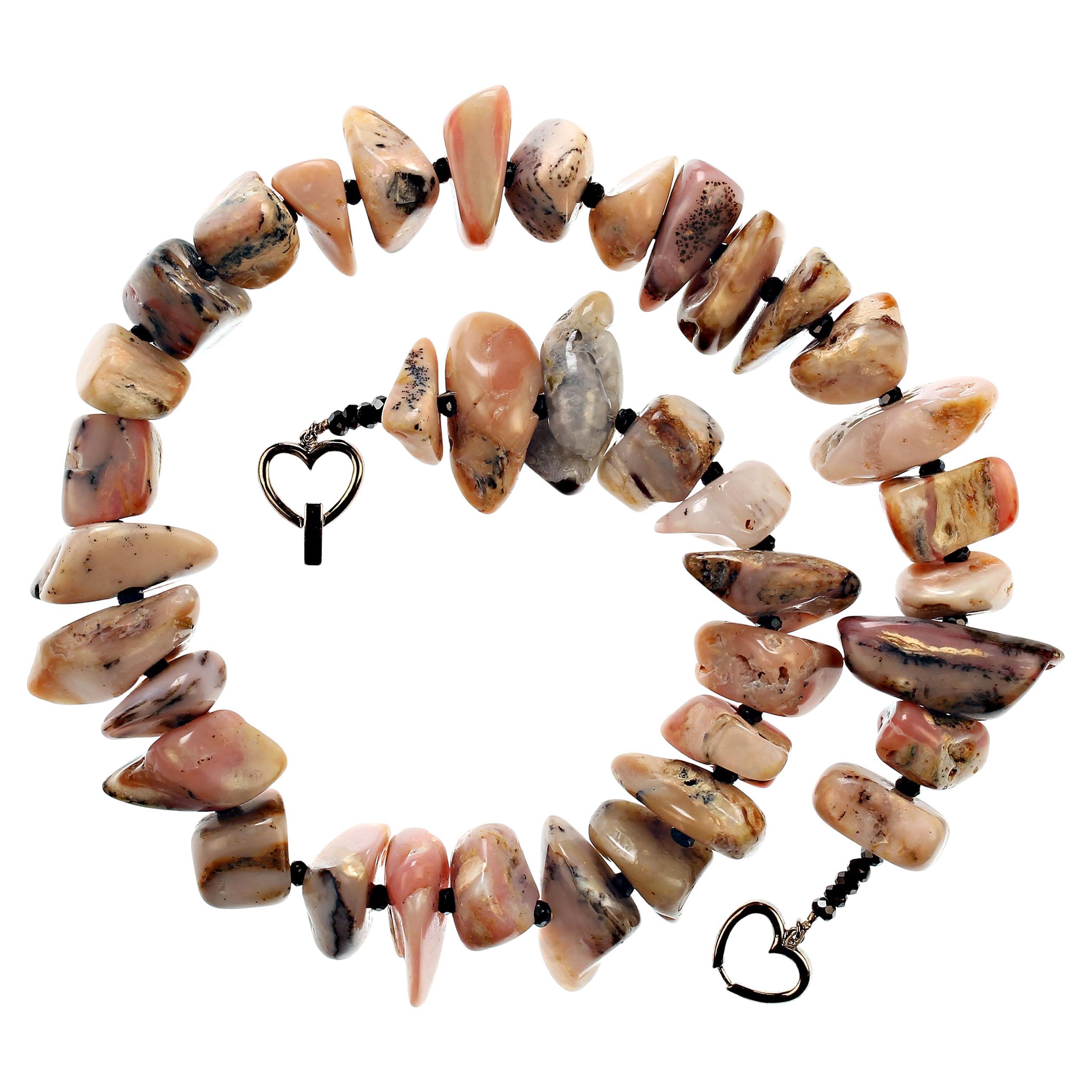 Tumbled and highly polished nuggets of Pink Peruvian Opal Necklace with double heart silver plate clasp. Total length of necklace is 21 inches. No two of these gemstones is alike, they are accented with faceted black Spinel to show off the unique