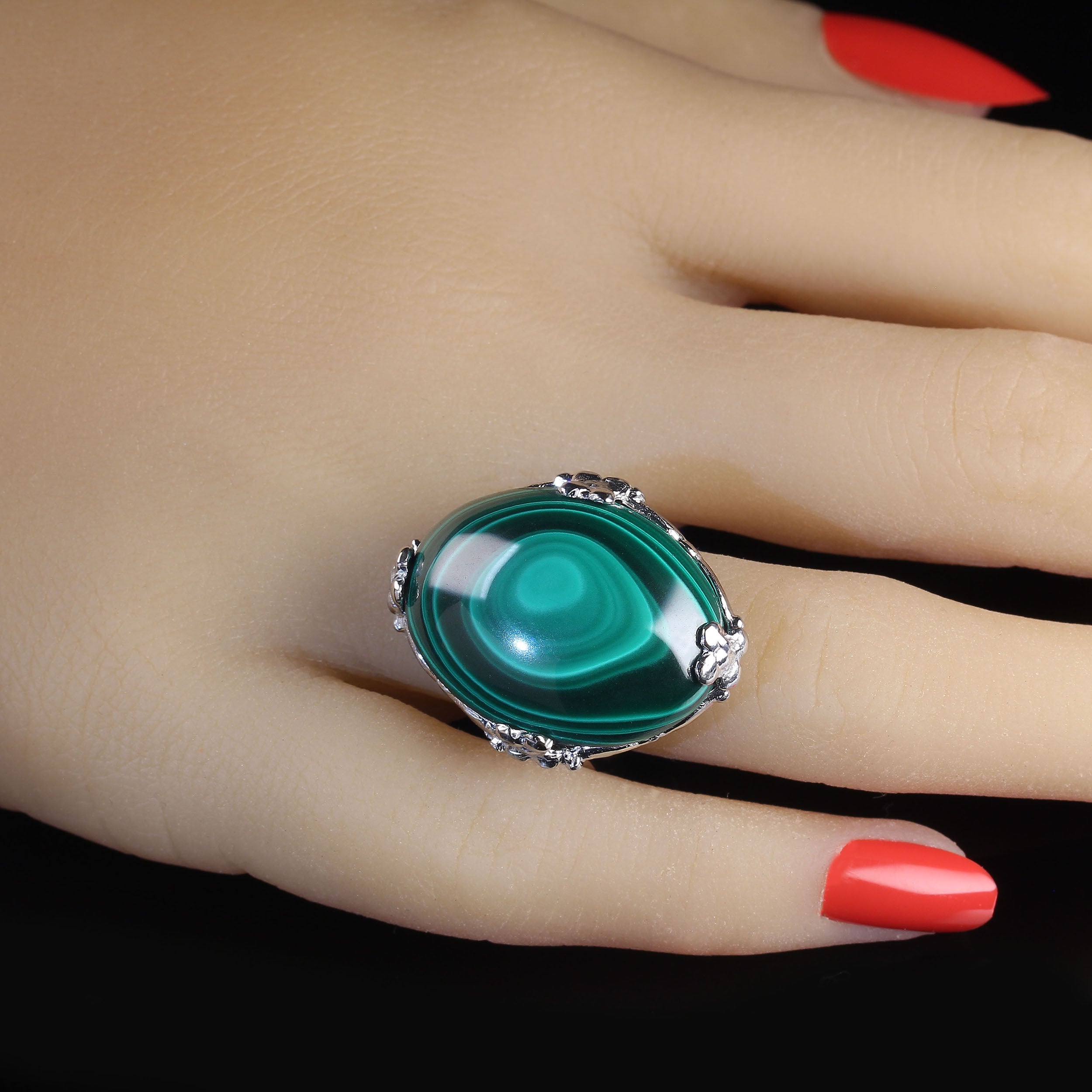 Glorious Green Malachite Cabochon Ring in 14K White Gold – 24x21mm
Make a statement with this stunning Green Malachite Cabochon Ring, custom-crafted in 14K white gold with intricate floral detailing. This elegant piece features a large 24x21mm