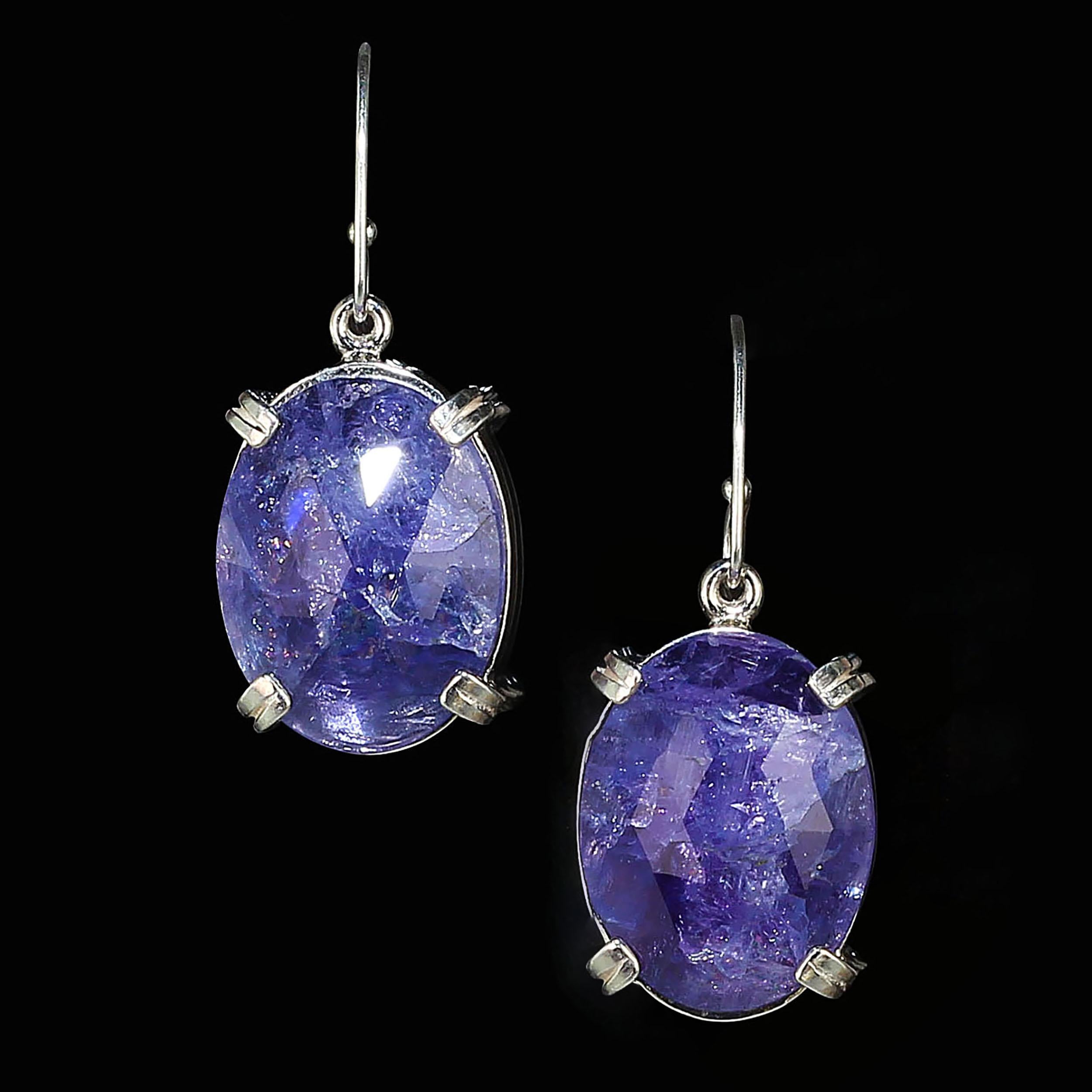
These Tanzanite earrings are perfect for when you're teleconferencing! And, they are available for immediate shipment.
Custom made earrings of large, purple/blue oval Tanzanite tablets with faceted tables. These unique Tanzanites are a stunning
