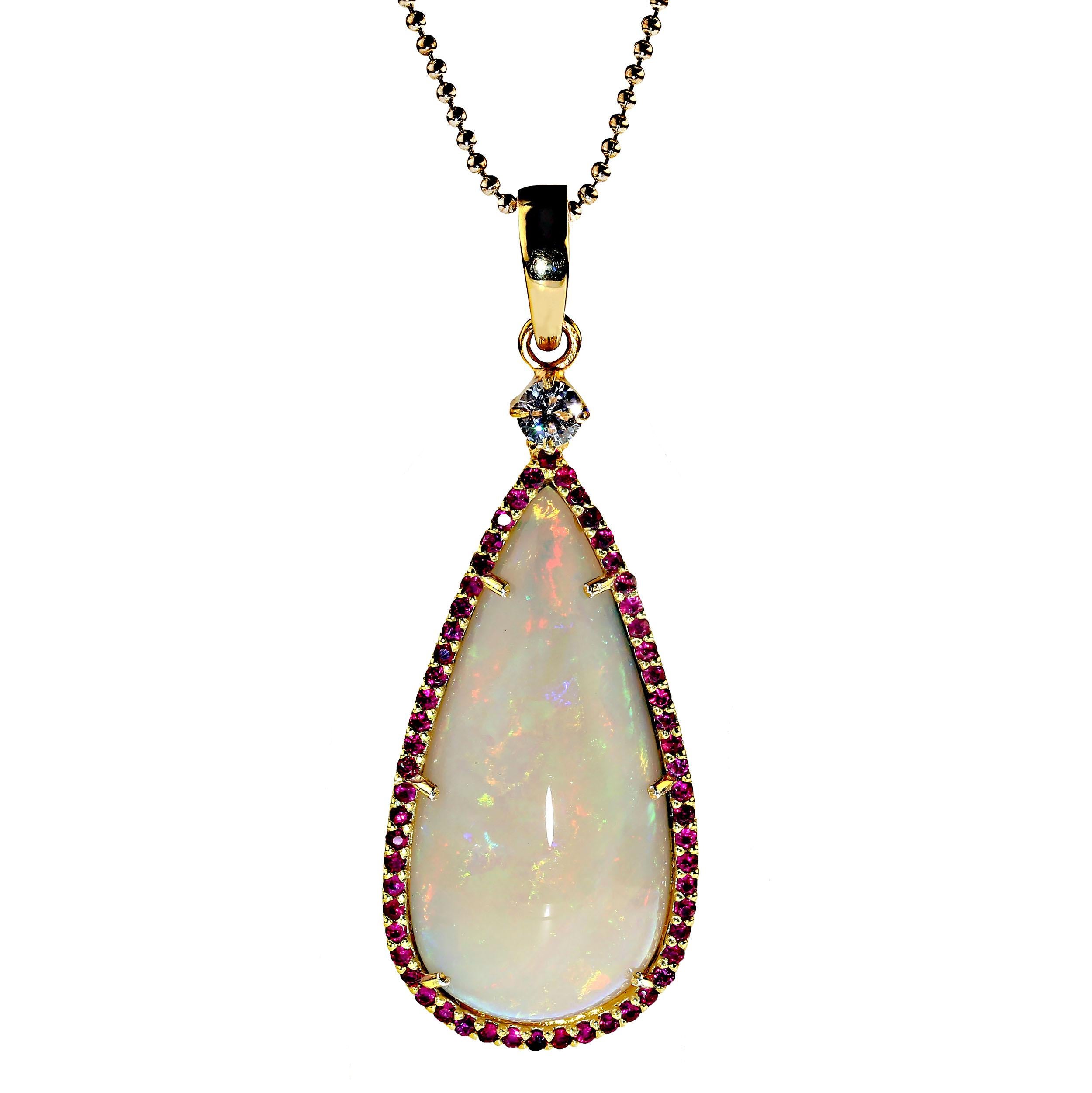 Pear Cut AJD Pendant of Magnificent Teardrop Opal Flashing Red & Green Surrounded by Ruby For Sale