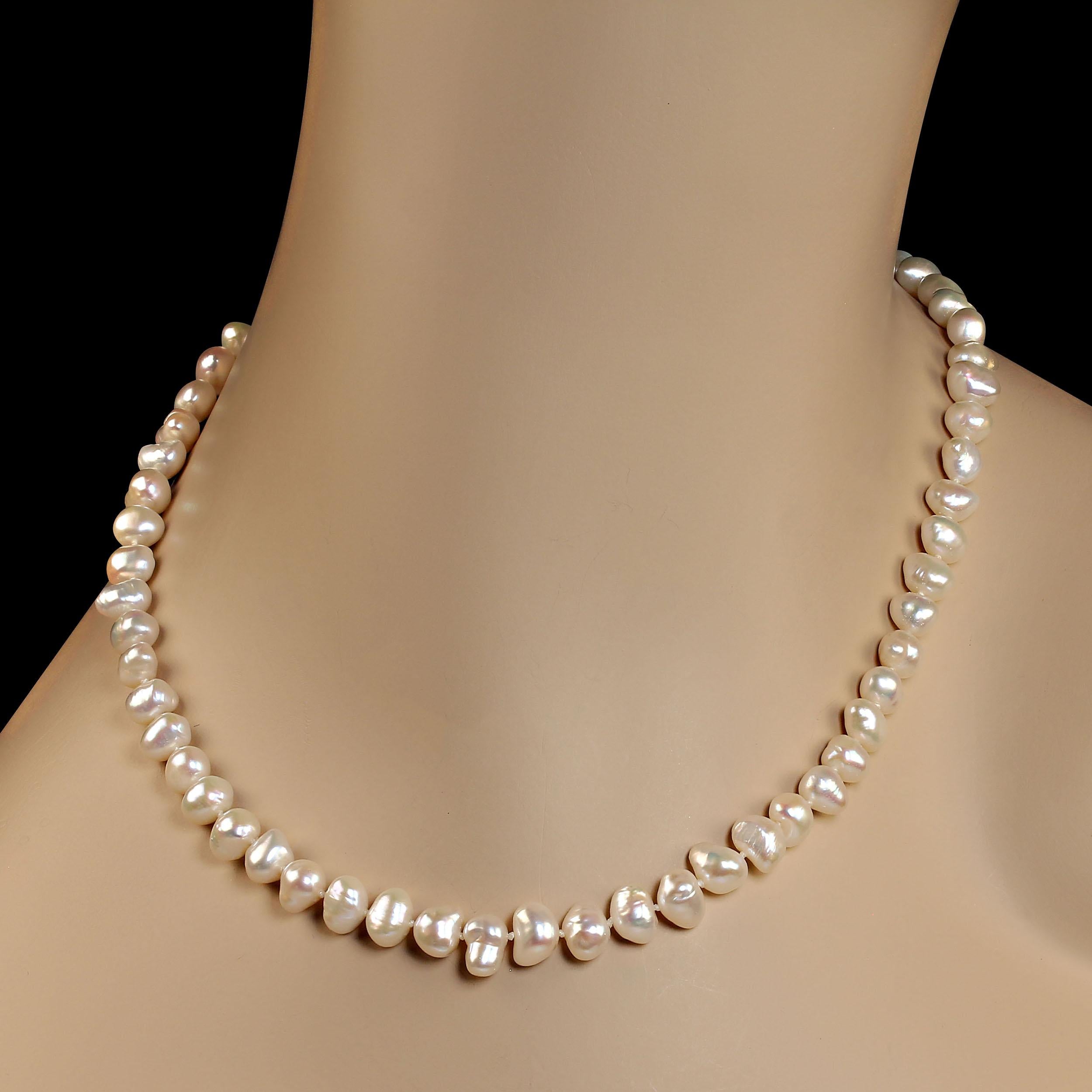 17-inch potato pearl, 8x6mm, necklace in that lovely creamy white color.  These pearls have an iridescence and glow that is amazing and truly lovely.  They are hand knotted and secured with a silver hook and eye clasp.  MN2331