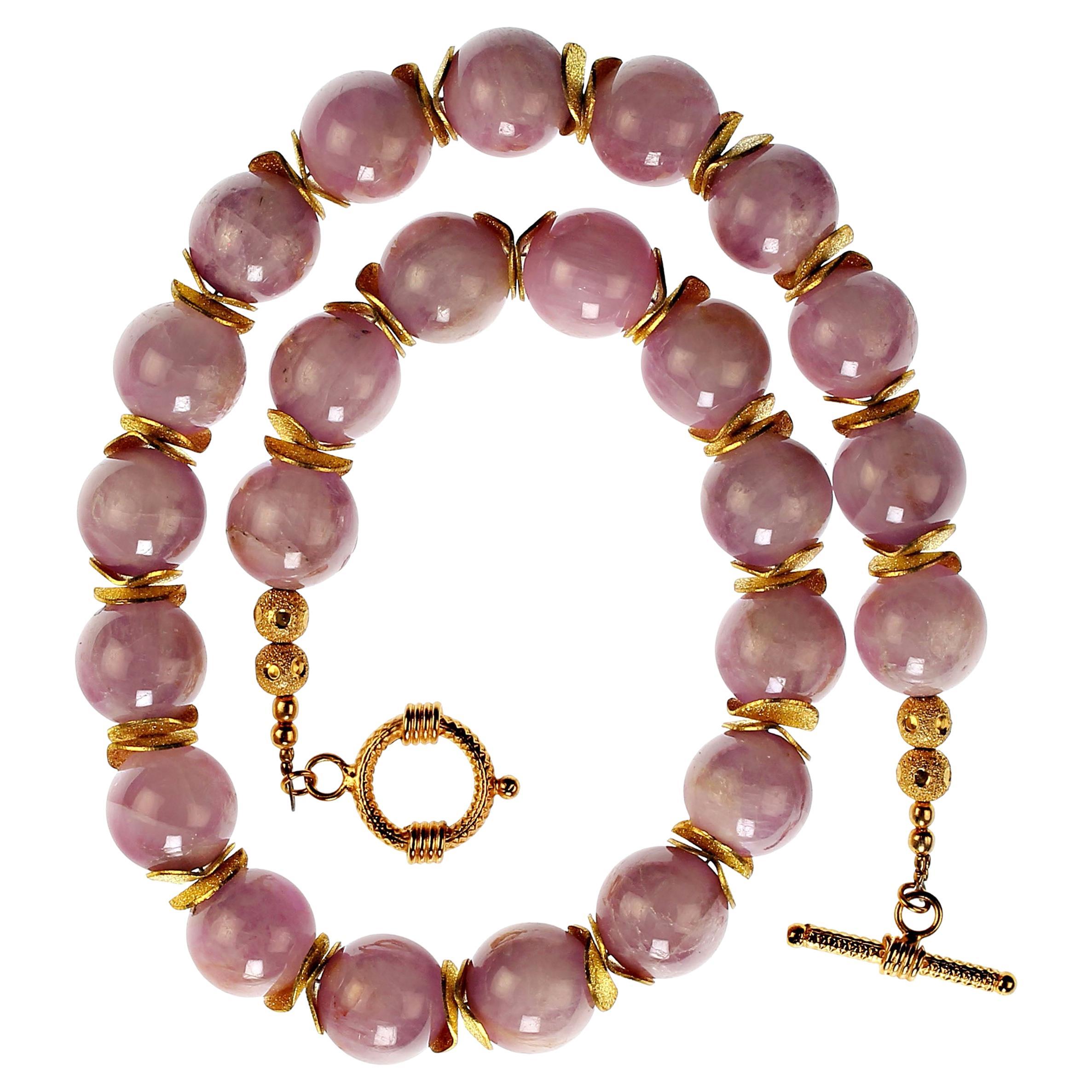 Delicate pink Kunzite necklace of 14 MM beads enhanced with double gold tone flutter spacers and a vermeil toggle clasp. This necklace is perfect for all seasons and complements all your wardrobe choices. Remember that these large beads diminish the