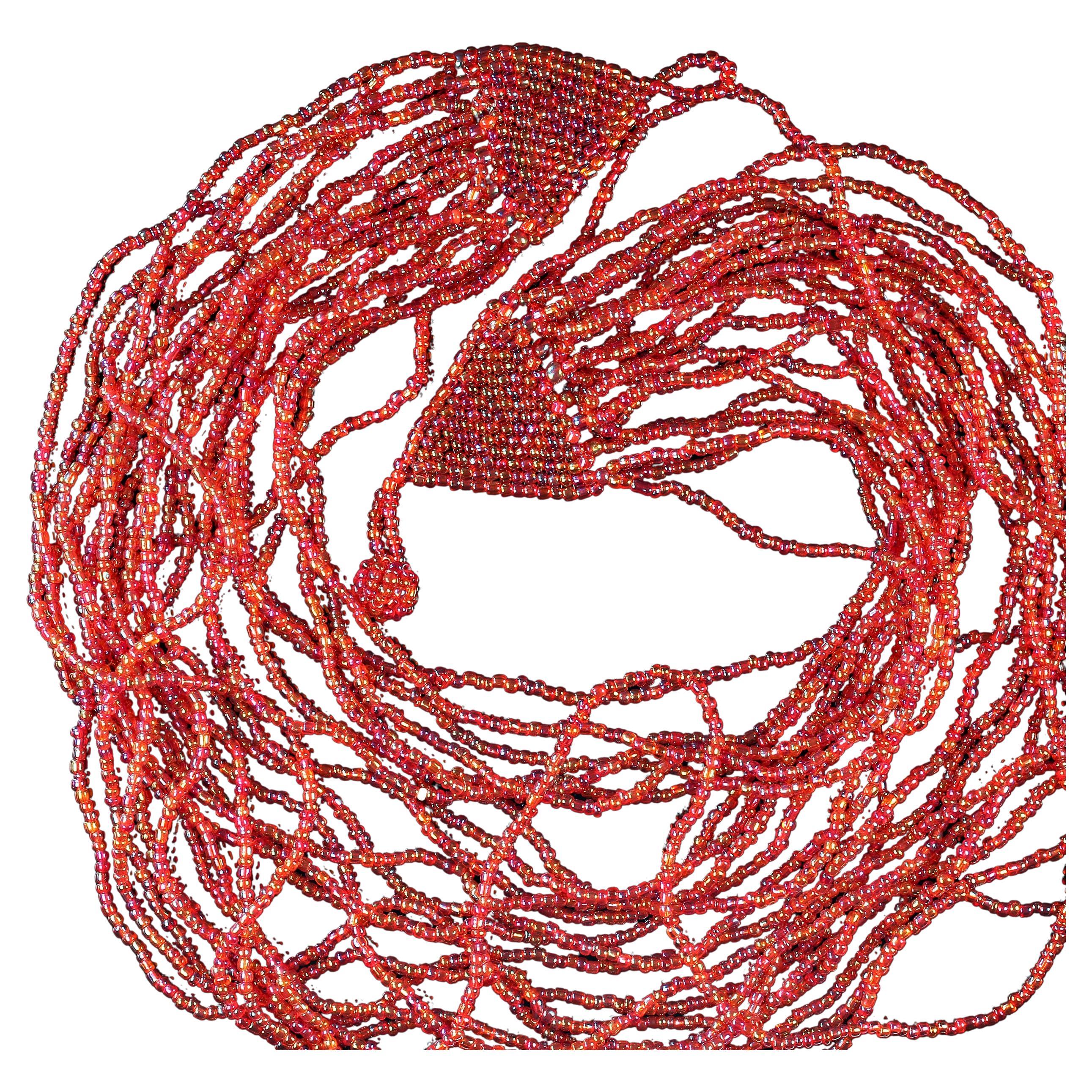 Gorgeous pink, multi-strand seed bead necklace that looks like a beautiful bib.  The 23 strands vary in length from 17 to 35 inches in length.  MN2304.