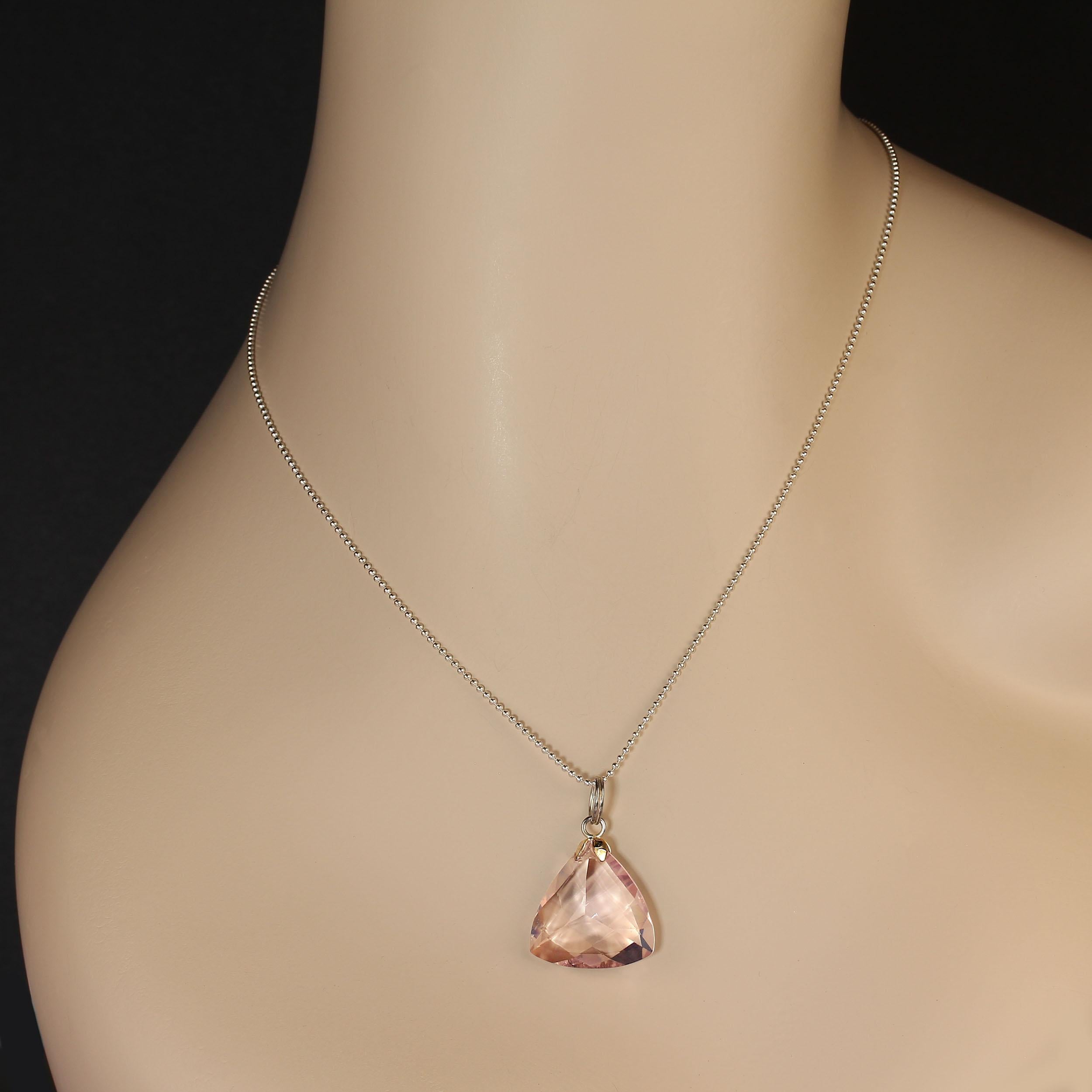 Finish your look with this triangle of soft pink Rose Quartz.  Loop in silver tone metal to hang this 30mm  trilliant pendant on your favorite chain or cord. 21mm x 20mm.  This is such a lovely pendant, beautifully faceted, it has just a touch a