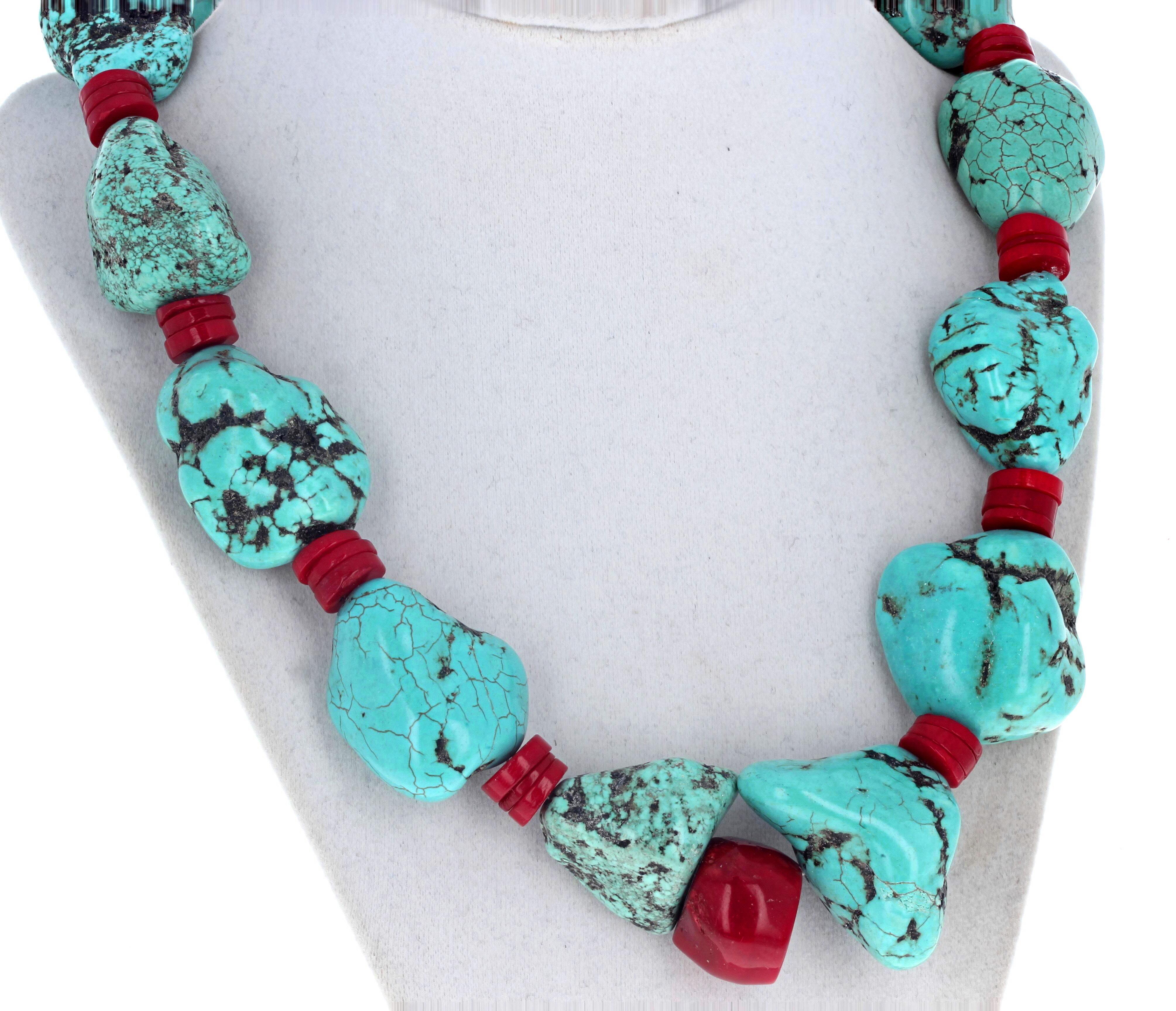 This fascinating necklace is 22 inches long and is highly polished chunks of natural Turquoise enhanced with natural real red Coral.  The largest Turquoise is approximately 33mm x 36mm and the coral rondels are 10mm.  The clasp is sterling silver.  