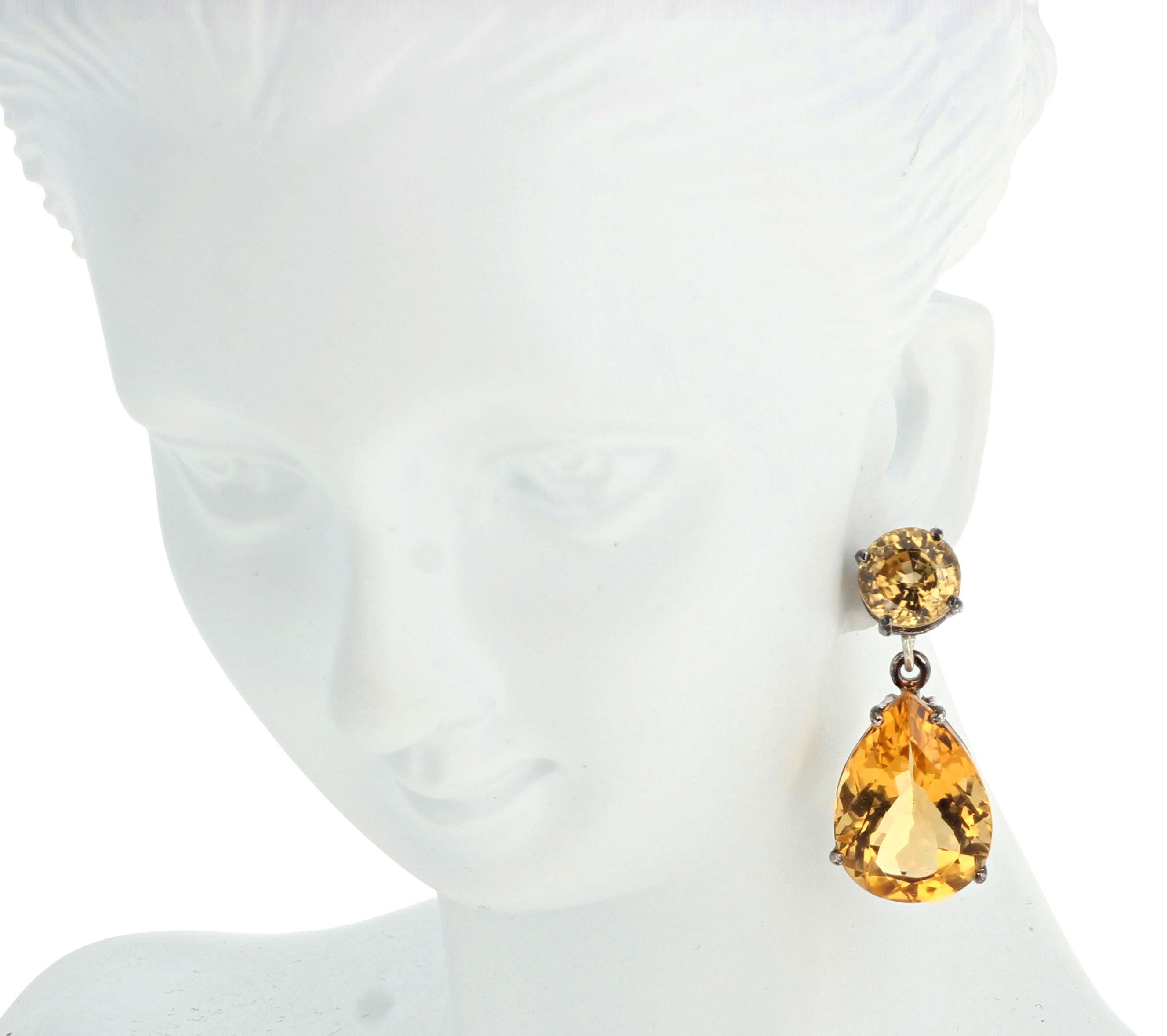These amazingly glittery natural very rare round Yellow Zircons total 5.35 carats (6.8mm).  The brilliant goldy yellow natural Citrines total 16.4 carats (17mm x 12mm).  They are set in easy to use sterling silver stud earrings.  There are no eye