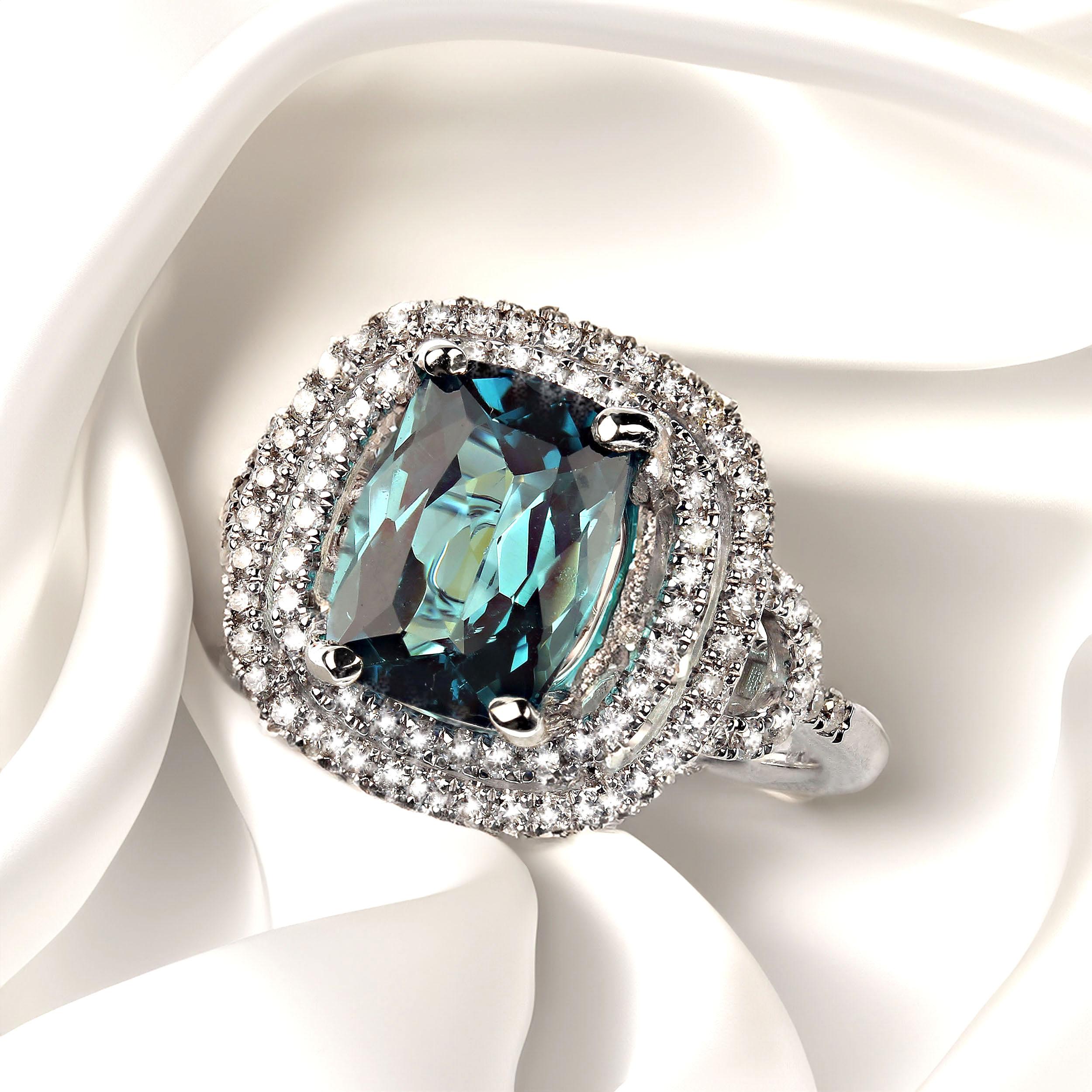Blue indicolite tourmaline, 2.54ct, beautifully accented with two rows of diamonds. This antique cushion cut beauty comes straight from one of our favorite vendors in the mountains outside of Rio de Jameiro.  The setting is 14K white gold and