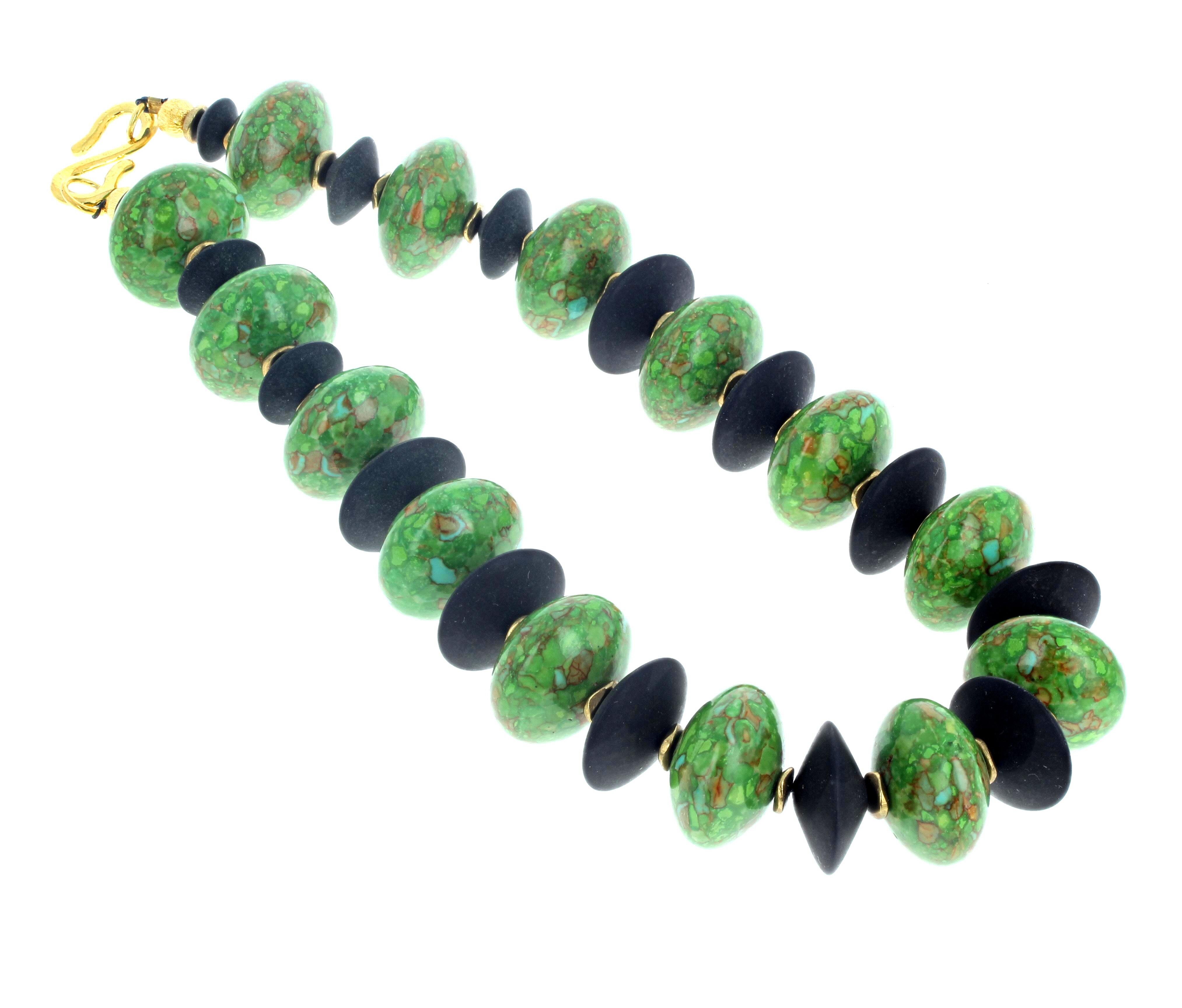 Beautiful natural green Turquoise enhanced with natural real black Onyx is 16 inches long.  The largest of the Green Turquoise is approximately 22mm.   The largest Black Onyx is approximately 20mm.  This lovely necklace has an easy to use gold