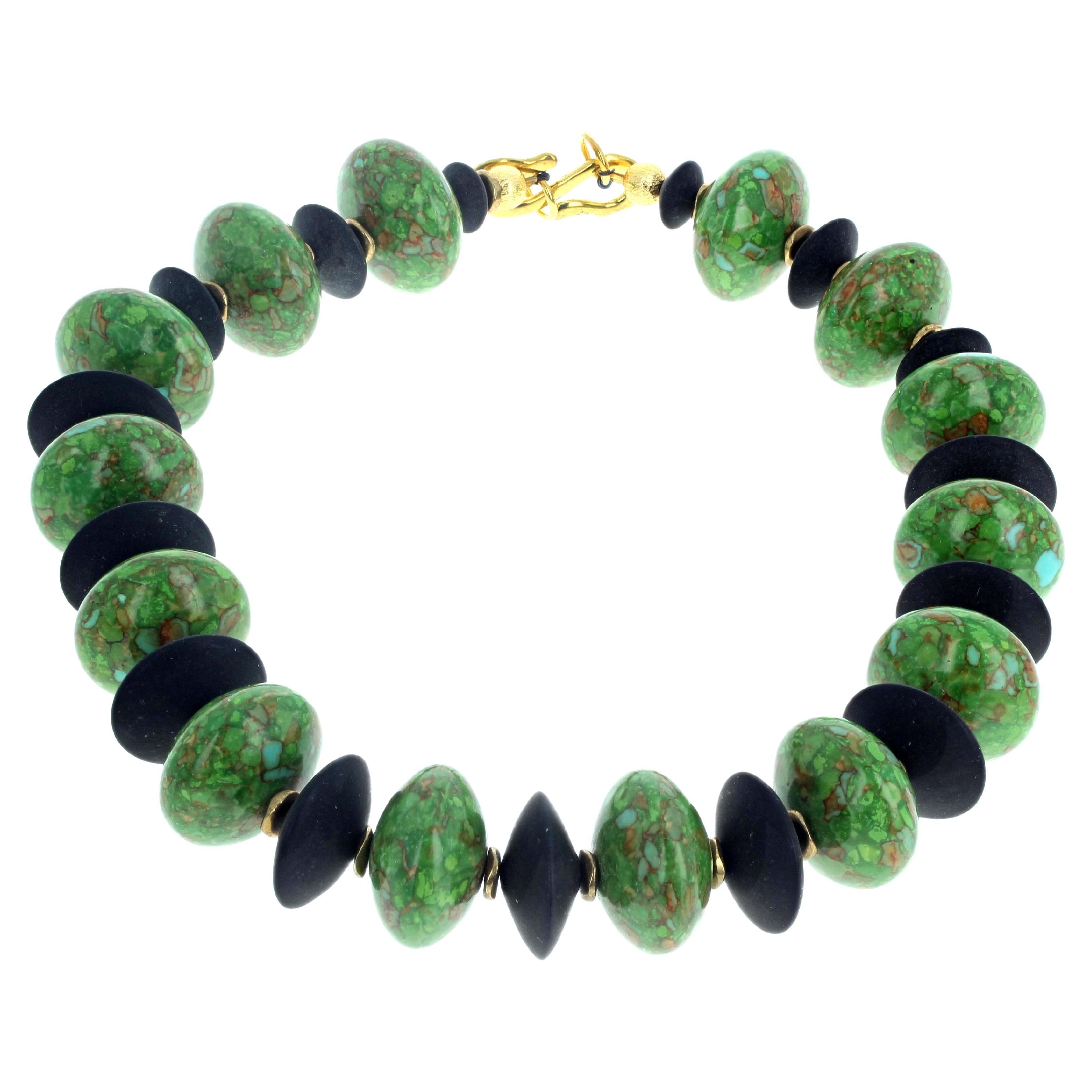 Beautiful natural green Turquoise enhanced with natural real black Onyx is 16 1/2 inches long.  The largest of the Green Turquoise is approximately 22mm.   The largest Black Onyx is approximately 20mm.  This lovely necklace has an easy to use gold