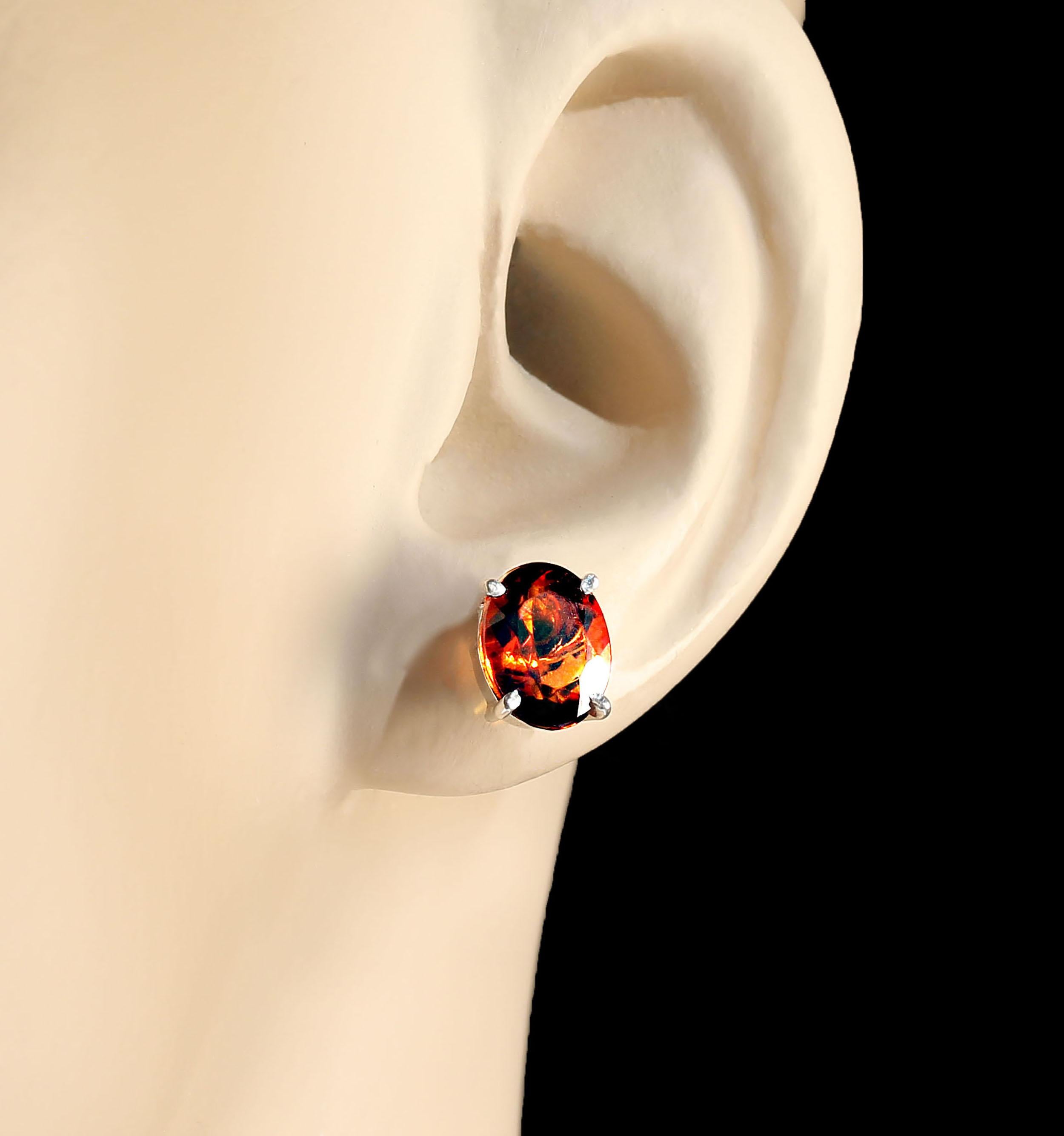 Sparkling oval, 9 x 7 MM, golden brown Citrines in four prong Sterling Silver stud settings. These versatile earrings are perfect for daily wear as well are evening sparkle. Post and push backs.   ME2323