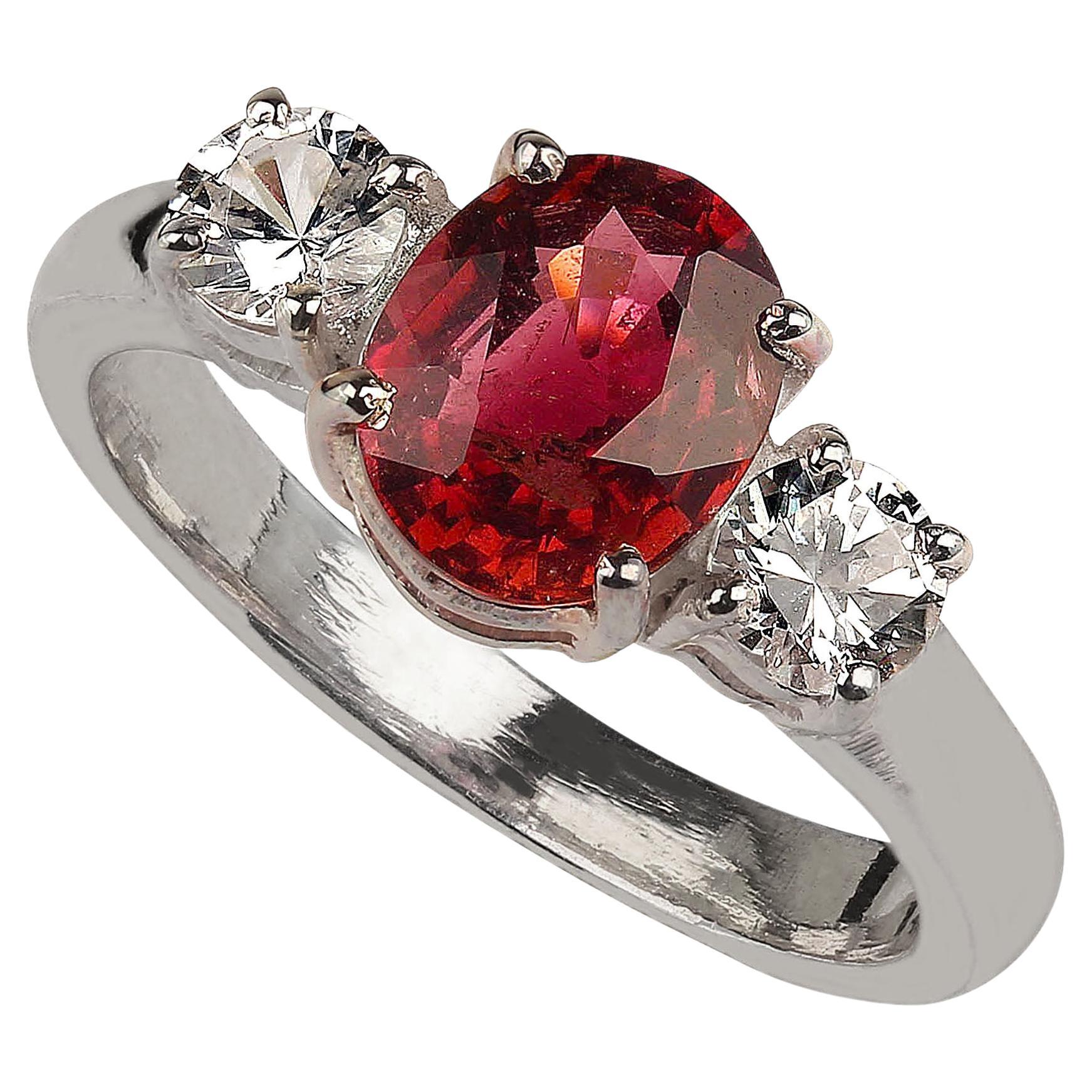 Delightful dinner ring of sparkling red tourmaline accented with genuine real Zircons.  This Sterling Silver sizable 7 ring is perfect for morning right through into the evening.  The oval red Tourmaline is 1.71cts and the genuine real Zircons, 0.61