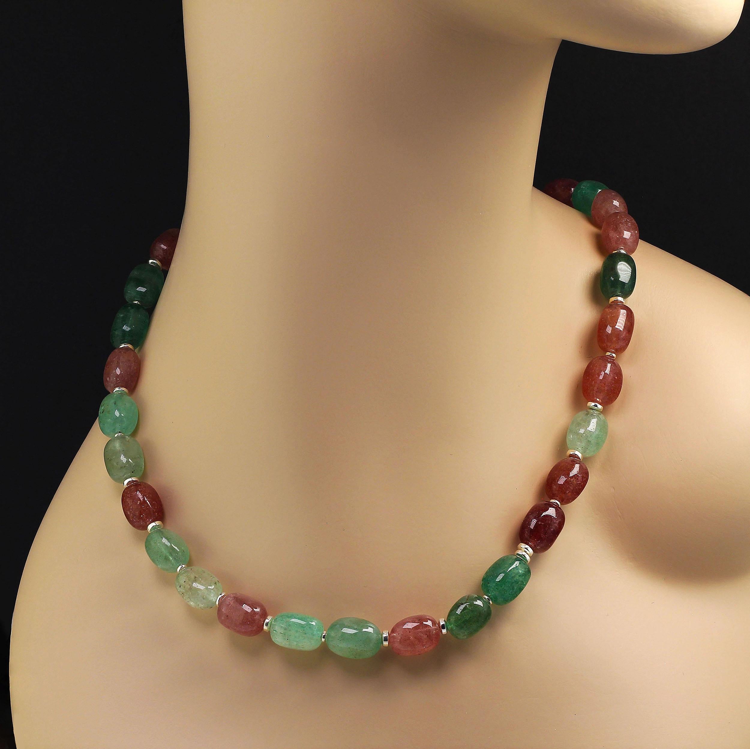 19 Inch necklace of highly polished barrel shaped quartz in lovely shades of rose and green. Arriving just in time for the holiday season this charming necklace will delight and amuse you. Shiny silvery spacers separate the red and green quartz. A