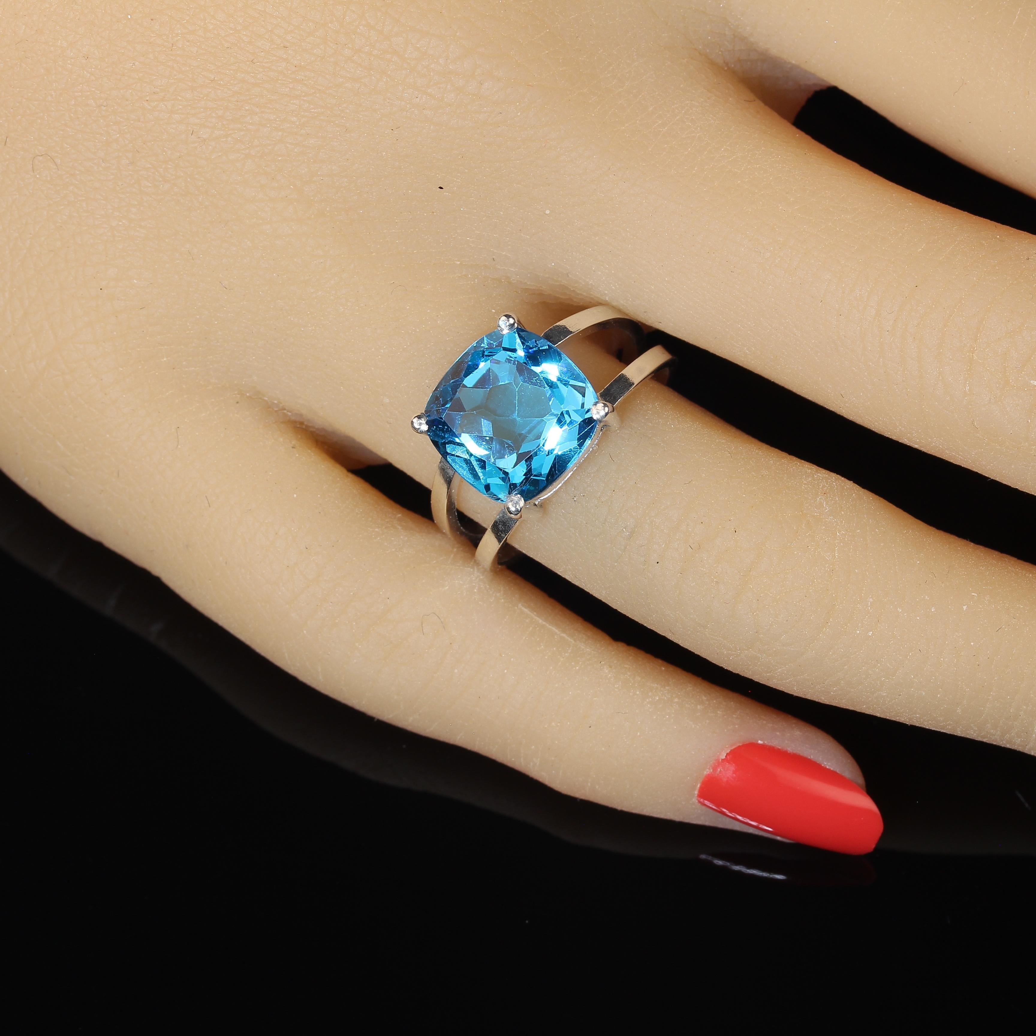 Scintillating Antique Cushion Cut 6Ct Swiss Blue Topaz set in a handmade Sterling Silver settng.  This setting was custom made in the studio of our favorite vendor in Belo Horizonte, Minas Gerais, Brasil.  This gorgeous gemstone sits in a basket
