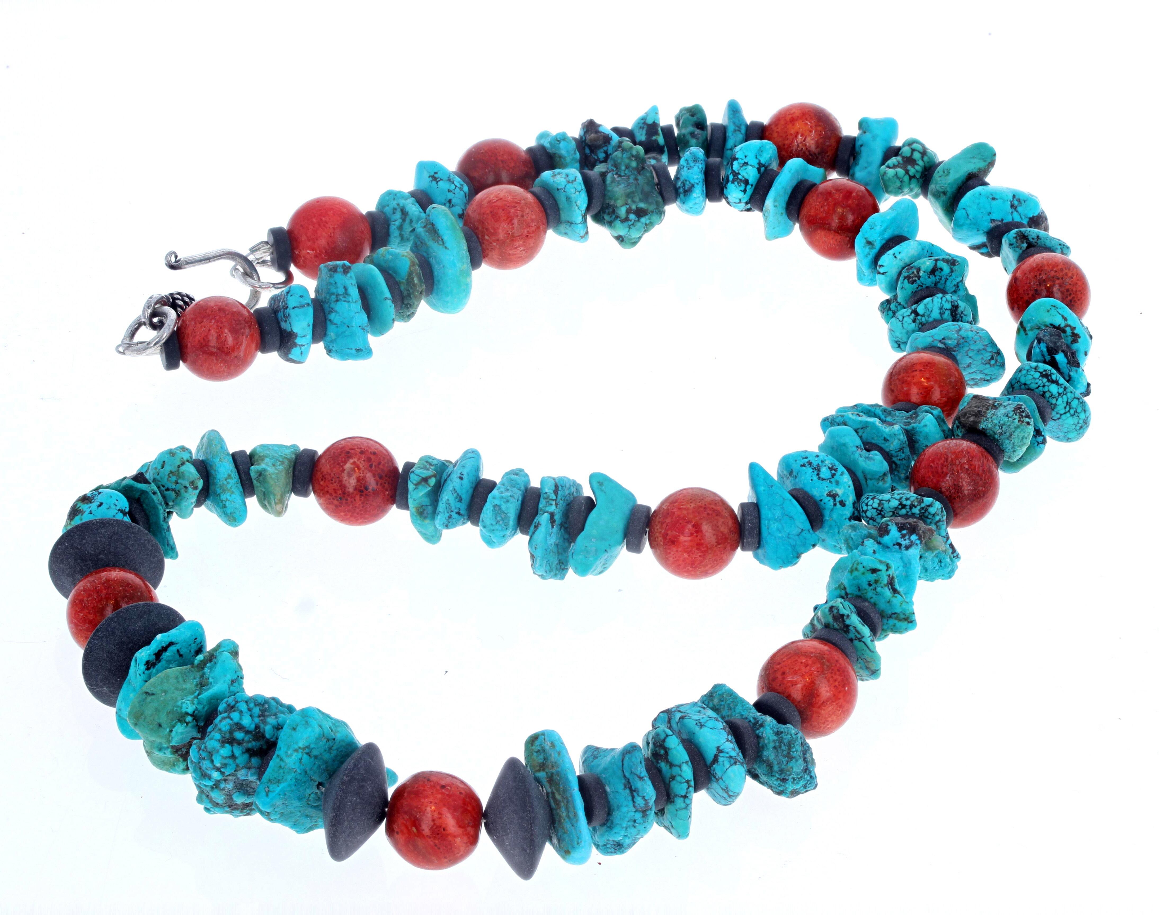 This elegant simple natural beautiful blue Turquoise and orangy Coral necklace is 25 inches long.  The larger polished chunks of Turquoise are approximately 13 1.2mm and the round orangy Coral are approximately 11 1/2mm all spaced with black Onyx. 