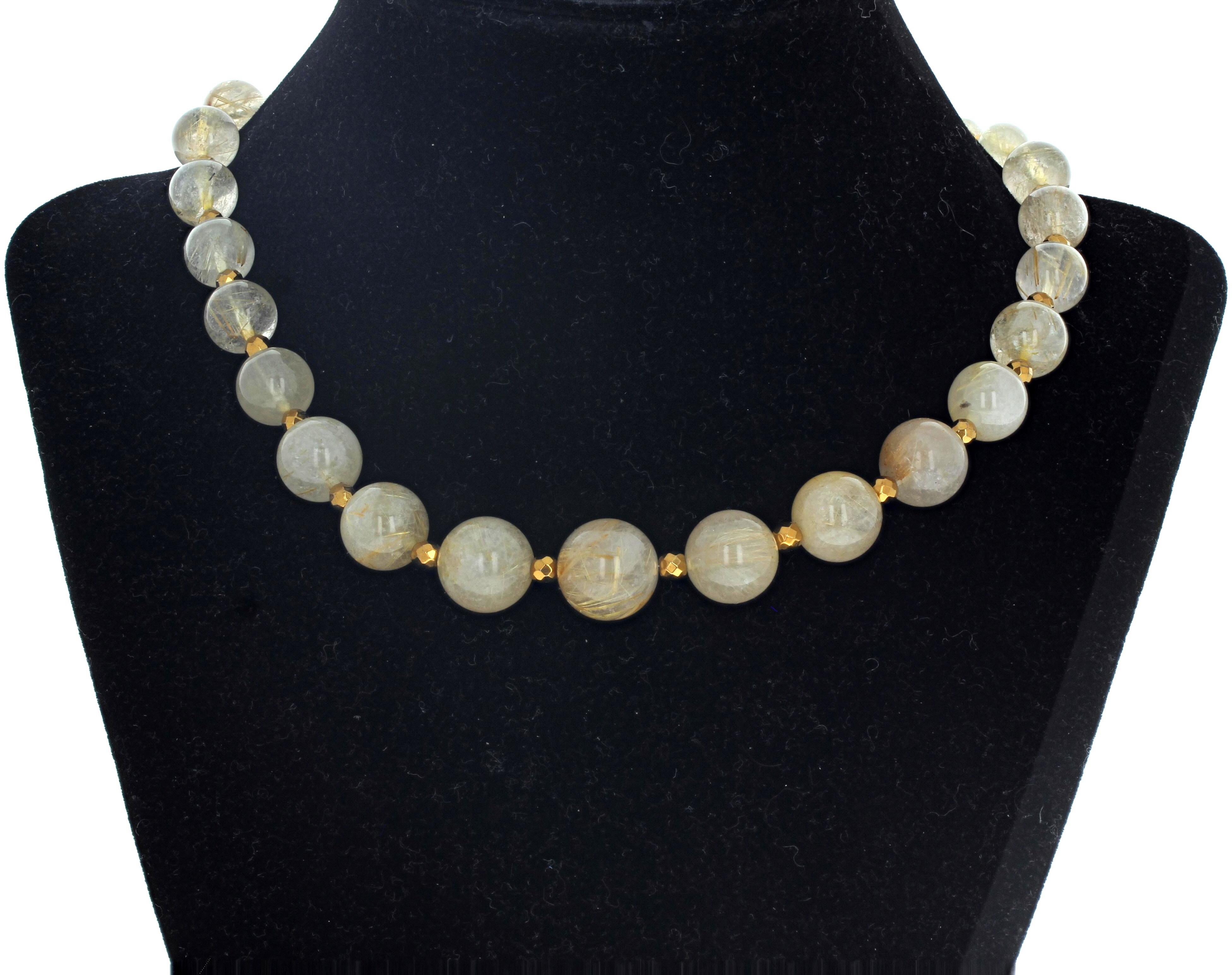 This lovely elegant 15 3/4 inch long natural polished round Rutilated Quartz is enhanced with gem cut and polished brilliant goldy spacers.  The largest Quartz is approximately 14mm.  The clasp is an easy to use gold plated hook clasp.  