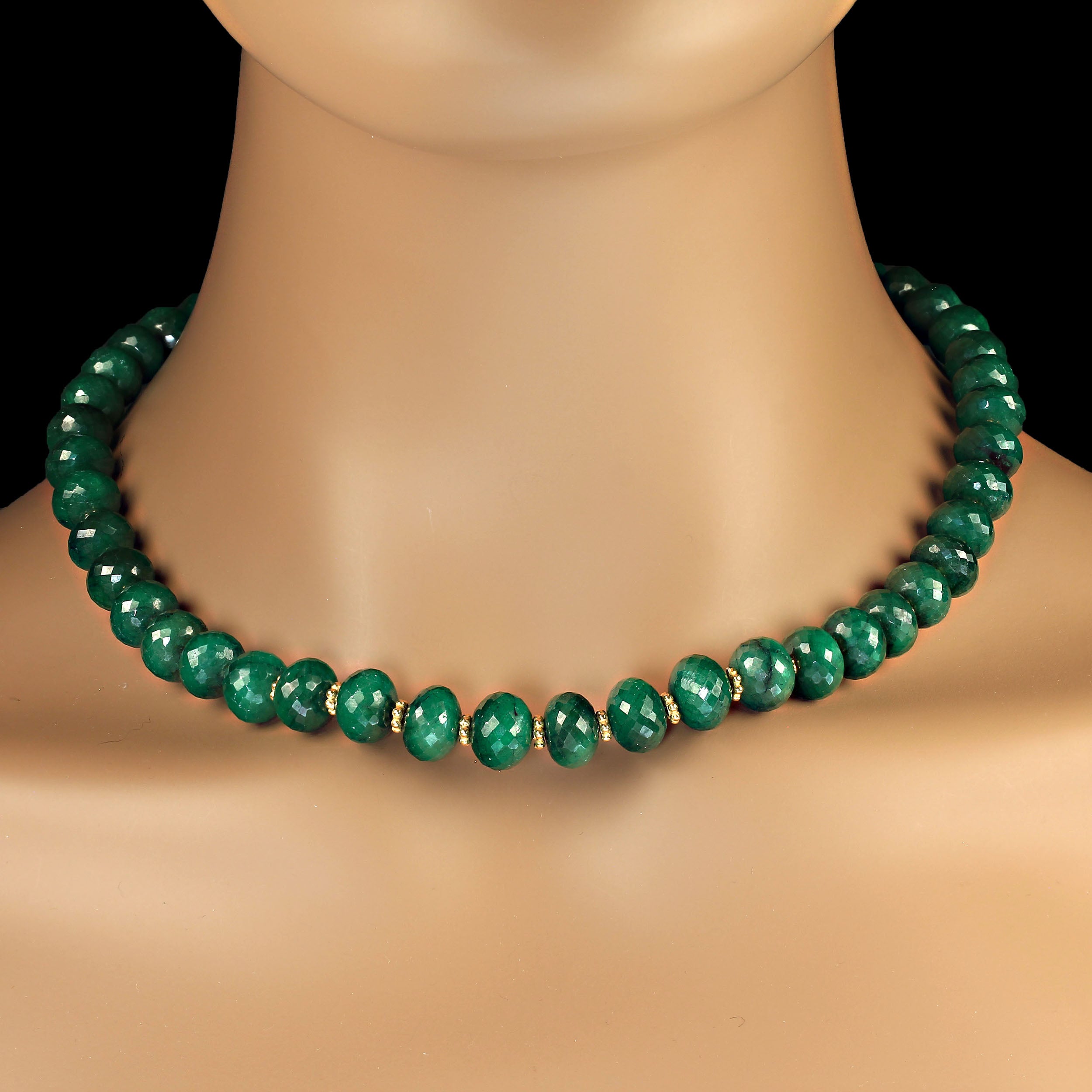 Introducing the 18-Inch Faceted Emerald Necklace – a stunning accessory designed for those who adore the timeless beauty of emeralds. This elegant necklace features slightly oval, not-quite-round faceted emerald beads, each one sparkling with