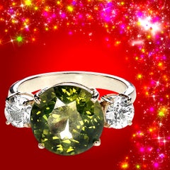 Bague cocktail sophistiquée en zircon vert et blanc « Big Deal » d
AJD