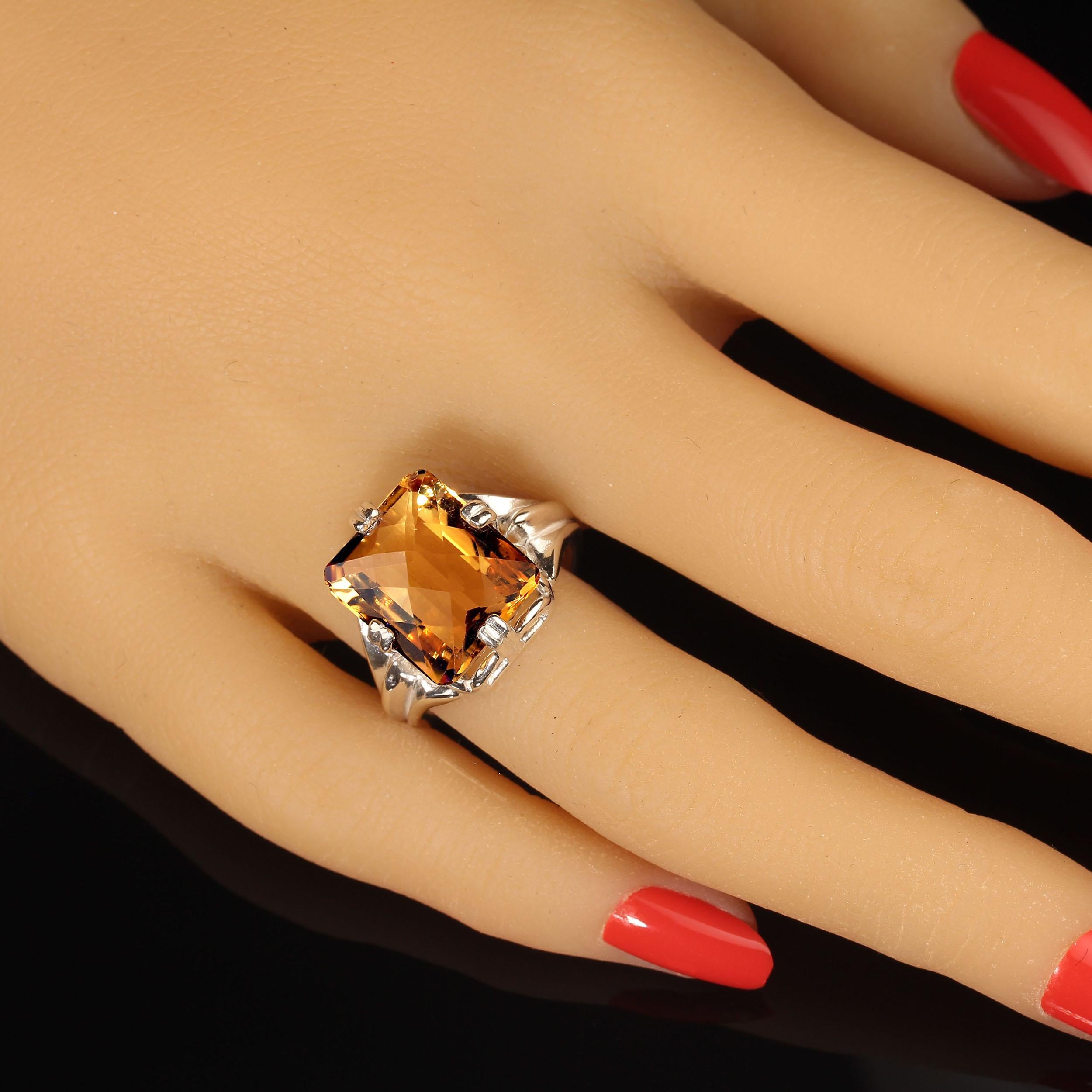 Elegant Sterling Silver setting with side prongs present this sprarkling Brazilian citrine to its greatest advantage. 7.52 carats of brilliance and glitter in this cushion cut checkerboard table citrine from one of our favorite Brazilian vendors. 