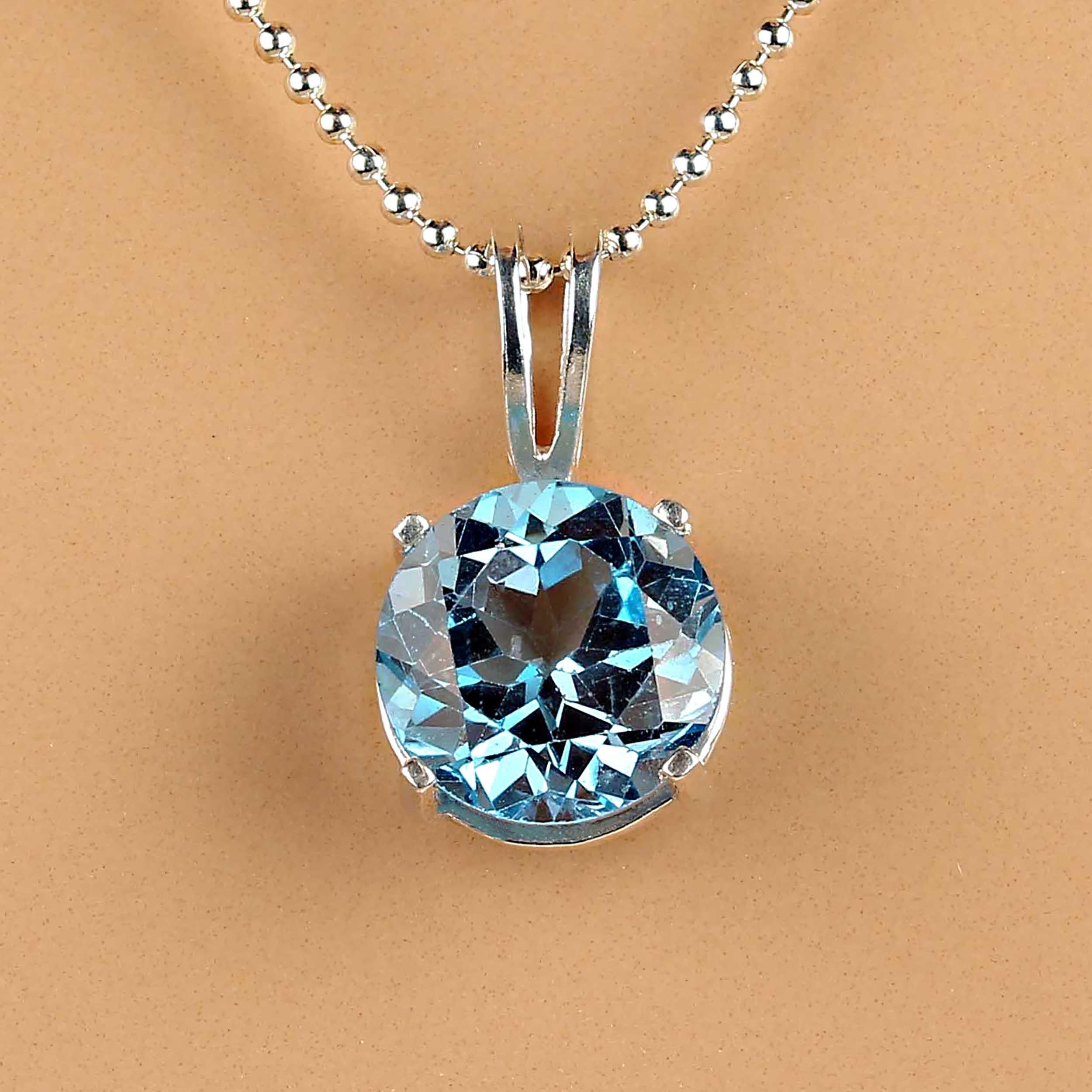 5Ct sparkling Swiss Blue Topaz and Sterling Silver pendant.  This is a delightful 10MM gemstone that has so much life!  The Sterling Silver pendant is 3/4 inches in length and 7/16 inches in width. MP2302.