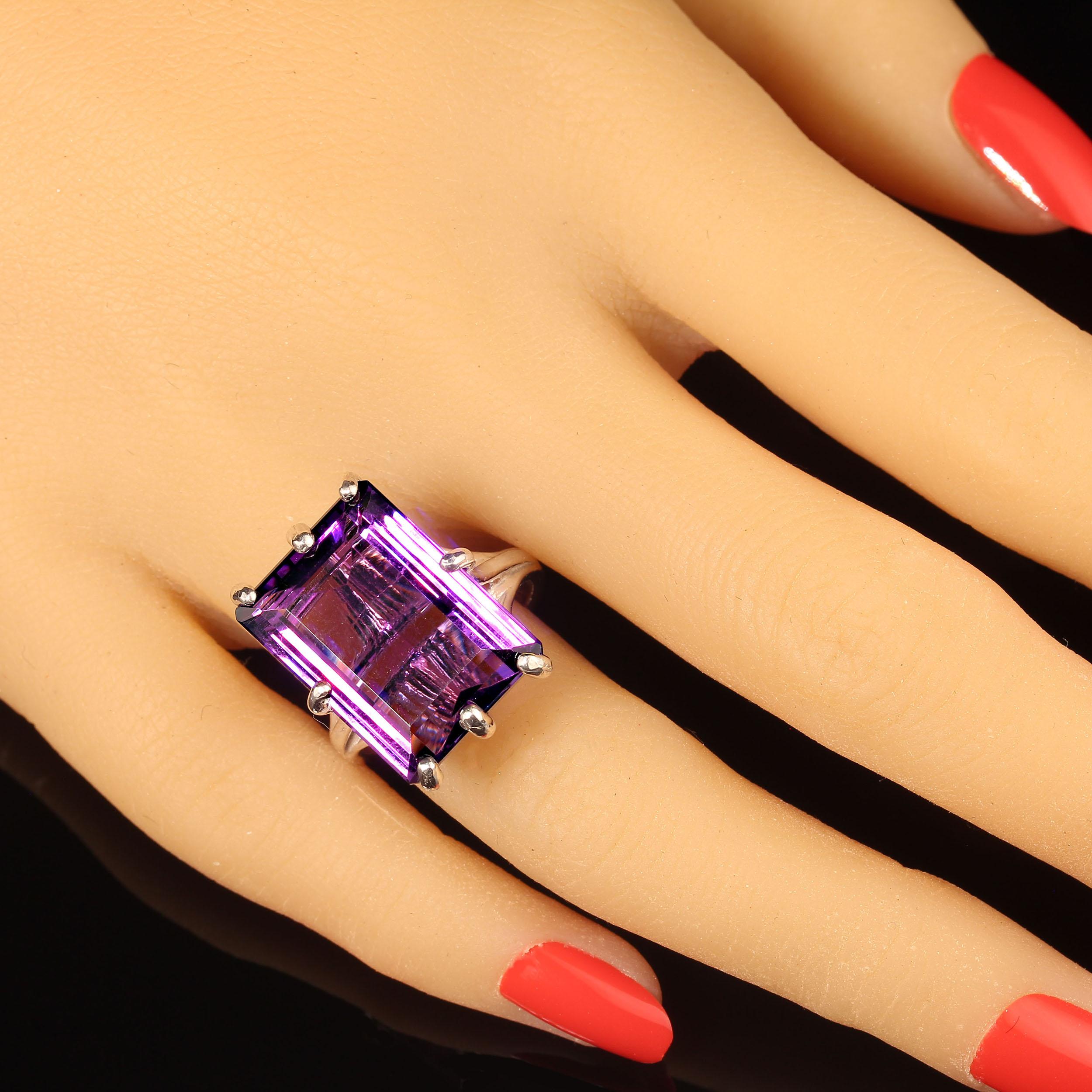 Fabulous Brazilian emerald cut Amethyst in Sterling Silver prong setting.  This Stunning amethyst is so clean and bright!  No changes by seller.  Sizable 8.   Amethyst is the February birthstone and is said to protect from intoxication and evil