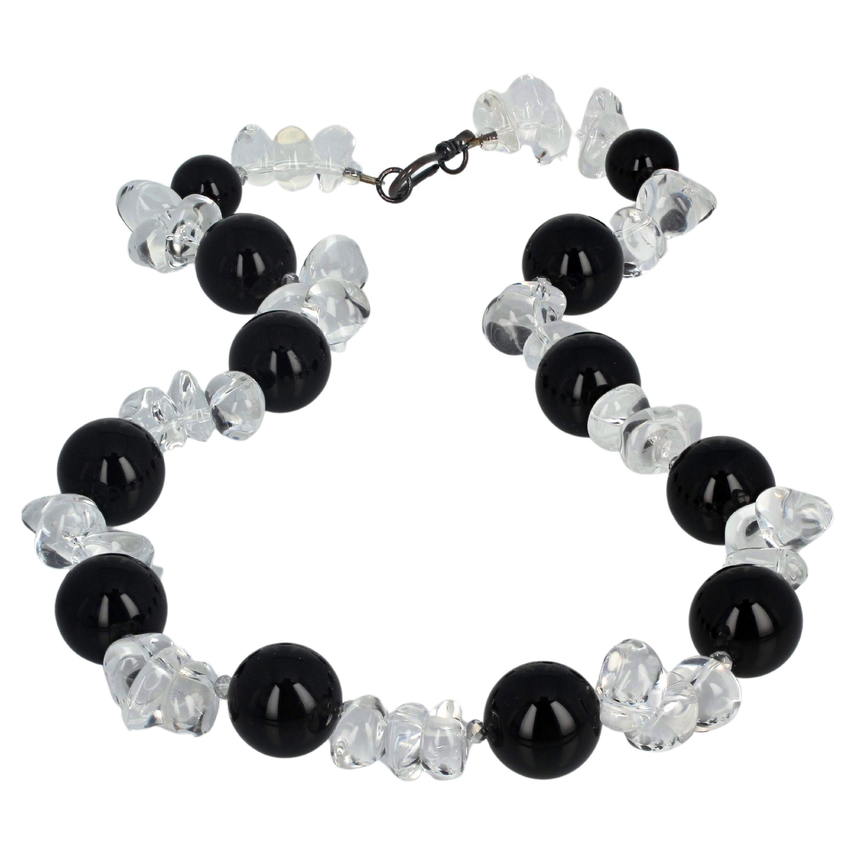 This sparkling stand-out necklace is 19 inches long.  The large black natural Onyx are 18mm.  The silvery translucent sparkling highly polished real white Quartz are chunky shapes to show off the beautiful black Onyx.  The clasp is darkened silver