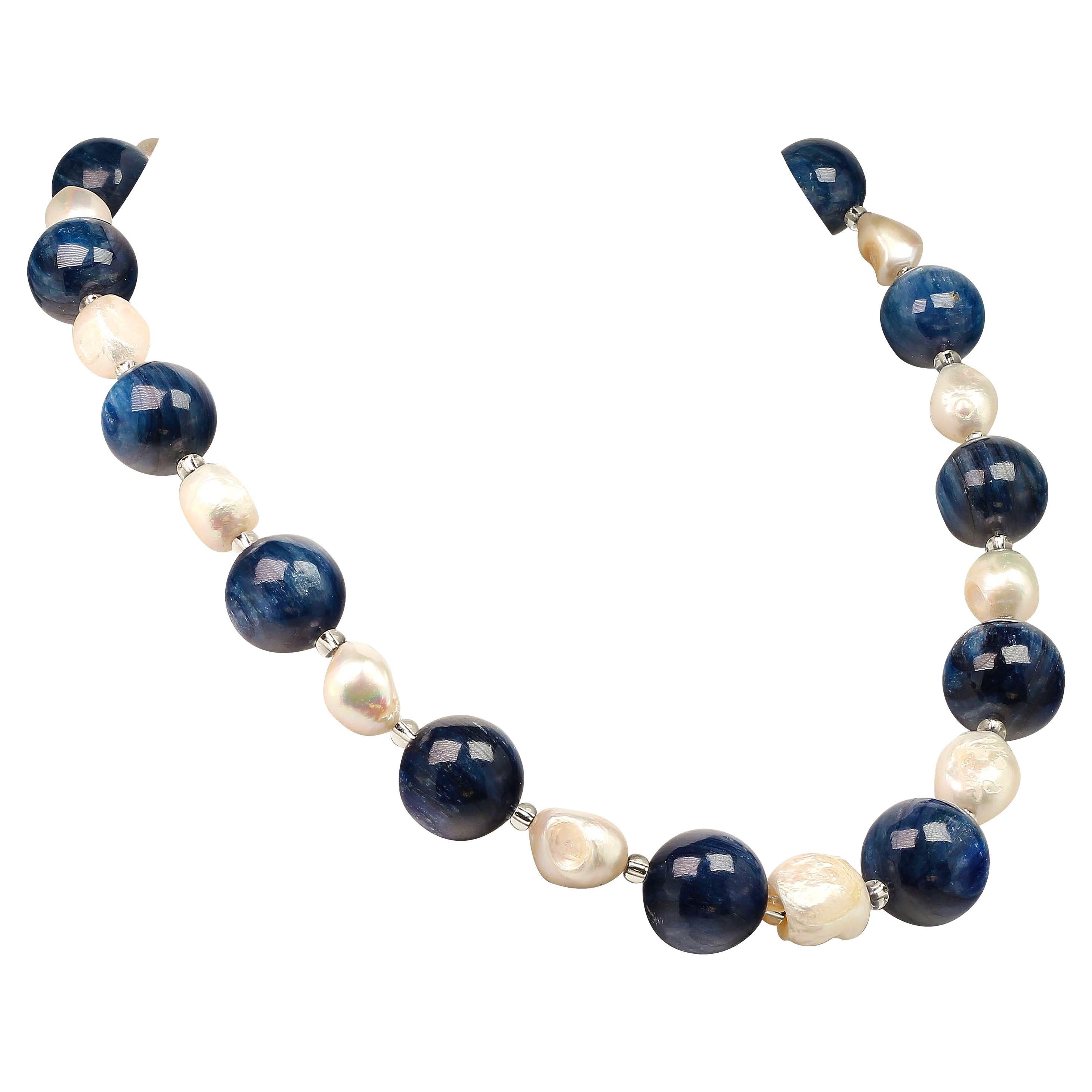 Own the jewelry you deserve

Gorgeous huge Kyanite highly polished matched with iridescent white Baroque Pearls in this one of a kind necklace.  Silvery Czech beads accent the beautifully striated Kyanite.  This 21 inch necklace is secured with a