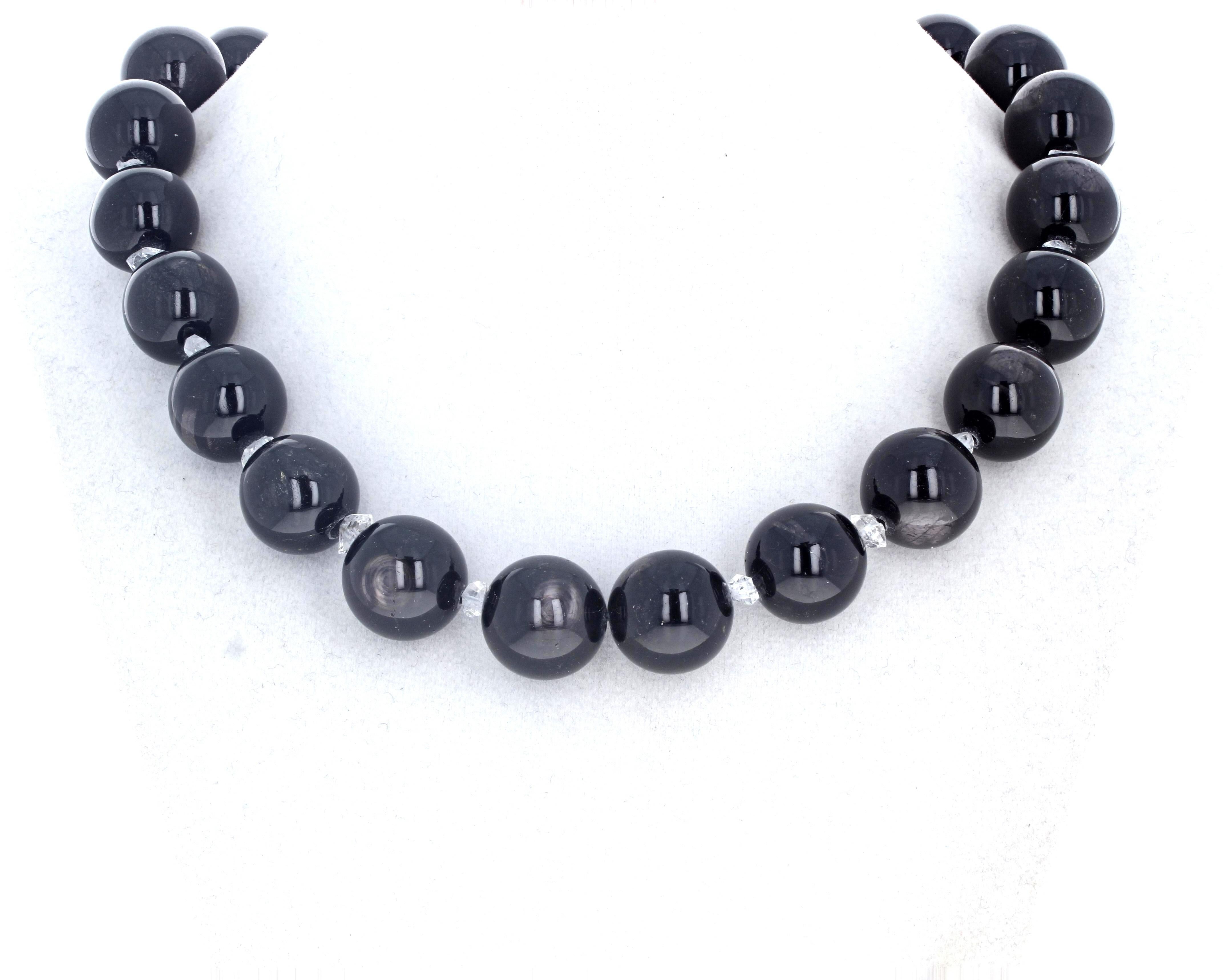 This magnificent dramatic necklace is of highly polished bright brilliantly black natural Onyx (approximately 16mm each) is 17 1/2 inches long.  They are enhanced with highly polished chips of natural glittering gem cut white 
