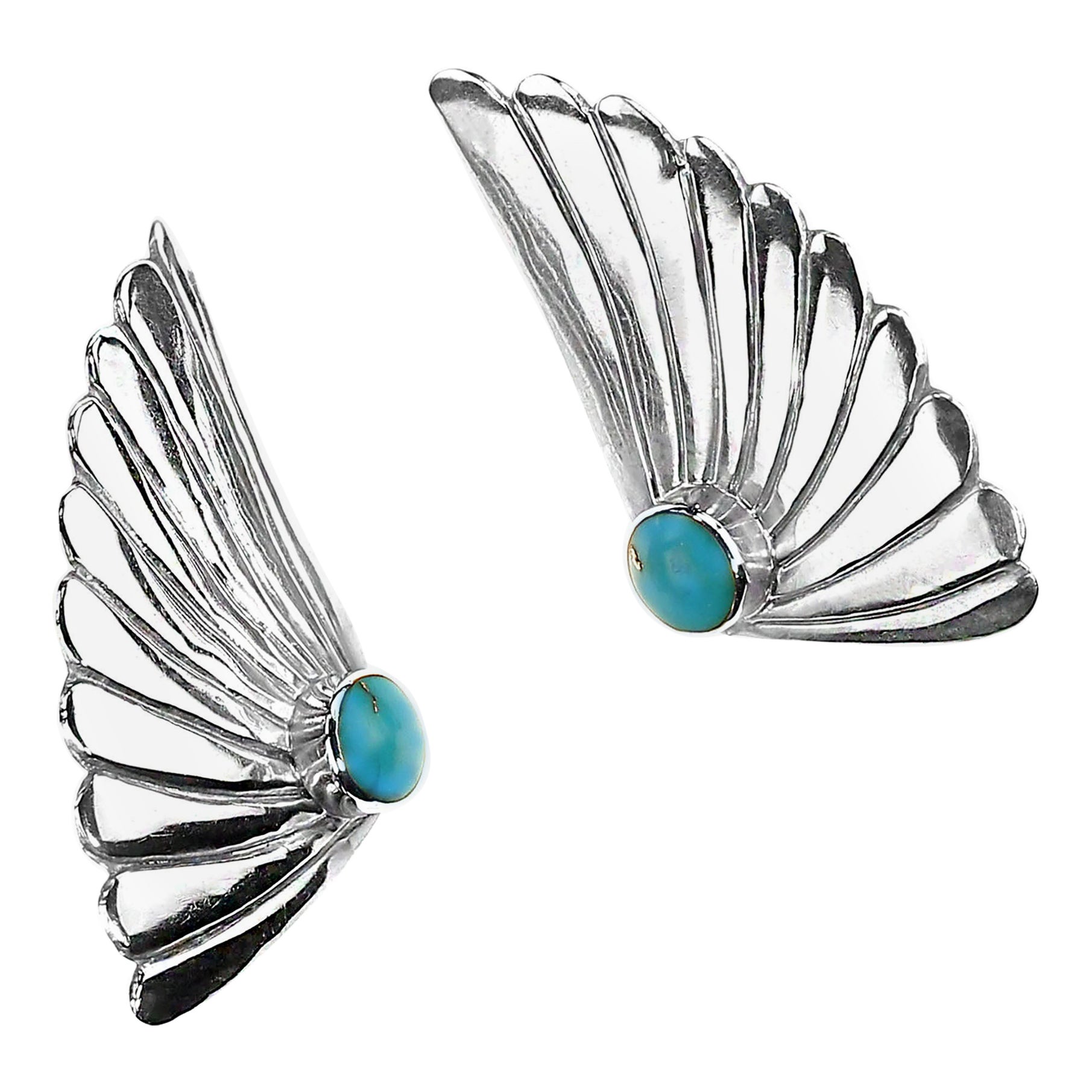 Exquisitos pendientes artesanales de plata y turquesa
Descubre la belleza de nuestros impresionantes pendientes artesanales de plata y turquesa, diseñados para causar sensación. Hechos de plata de ley estampada de alta calidad y turquesa natural,
