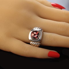 AJD Striking Sterling Silver ring with 14K accents and pinkish red Topaz