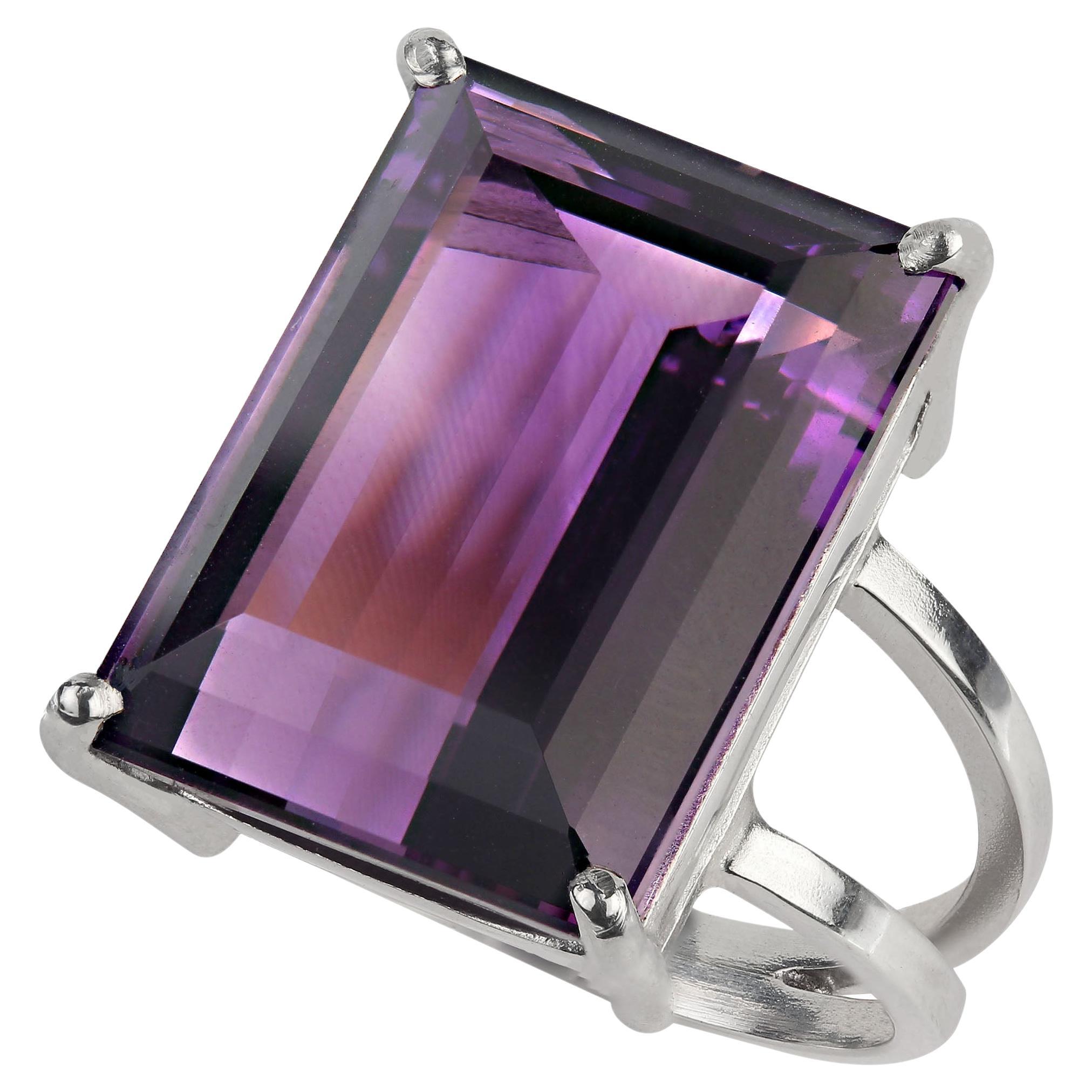 Stunning 18Ct Emerald Cut Amethyst in a handmade Sterling Silver ring.  This ring was handcrafted in Belo Horizonte, Minas Gerais, Brasil and comes from our favorite resident vendor with whom we've been working since back in the days when I lived in