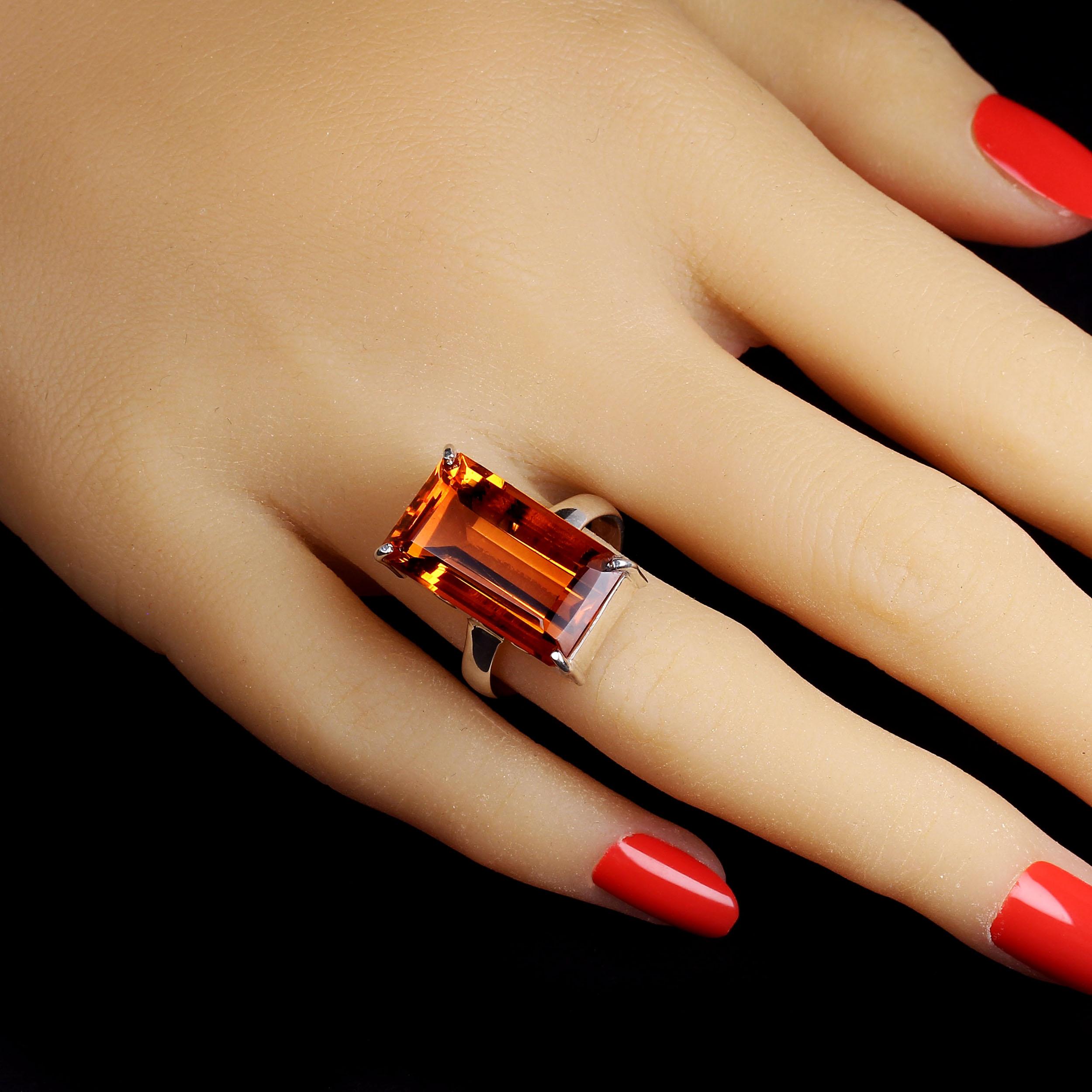 Stunning Brazilian emerald cut Citrine in Sterling Silver ring. This elegantly simple ring comes from our favorite vendor in Belo Horizonte, Minas Gerais, Brazil. He mines many of his own gemstones.  If not, he buys the rough and has it cut to his