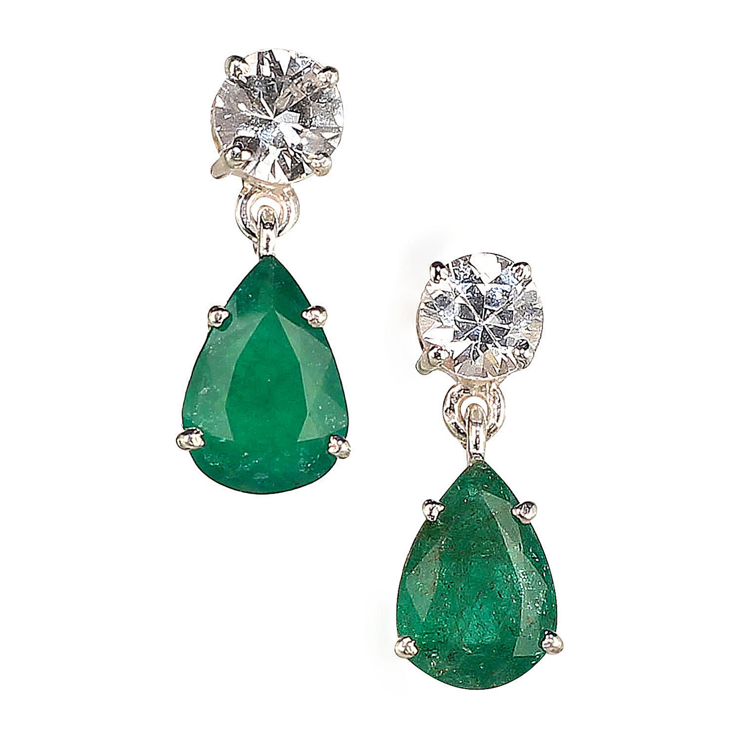 Lovely dangle Emerald and scintillating real Zircon earrings.  These gorgeous pear shape Emeralds come straight from Belo Horizonte, the capital of Minas Gerais, in central Brazil.  One of our favorite suppliers is our first stop in Belo because