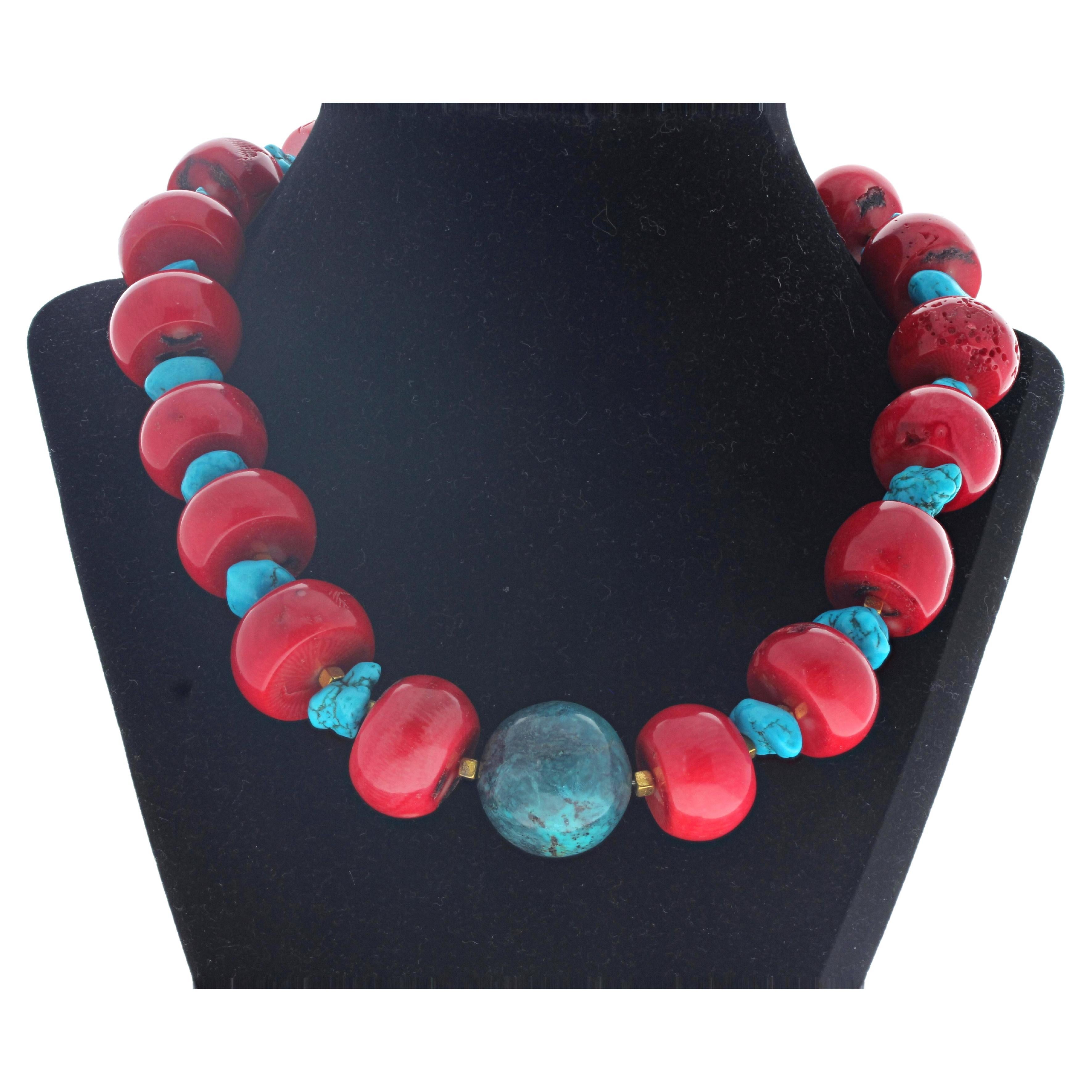 This dramatic necklace is 18 1/2 inches long.  The center Azurite is 24mm round.  The natural red corals are different sizes with the largest being approximately 23mm x 15mm thick.  The clasp is an easy to use gold plated hook clasp.  