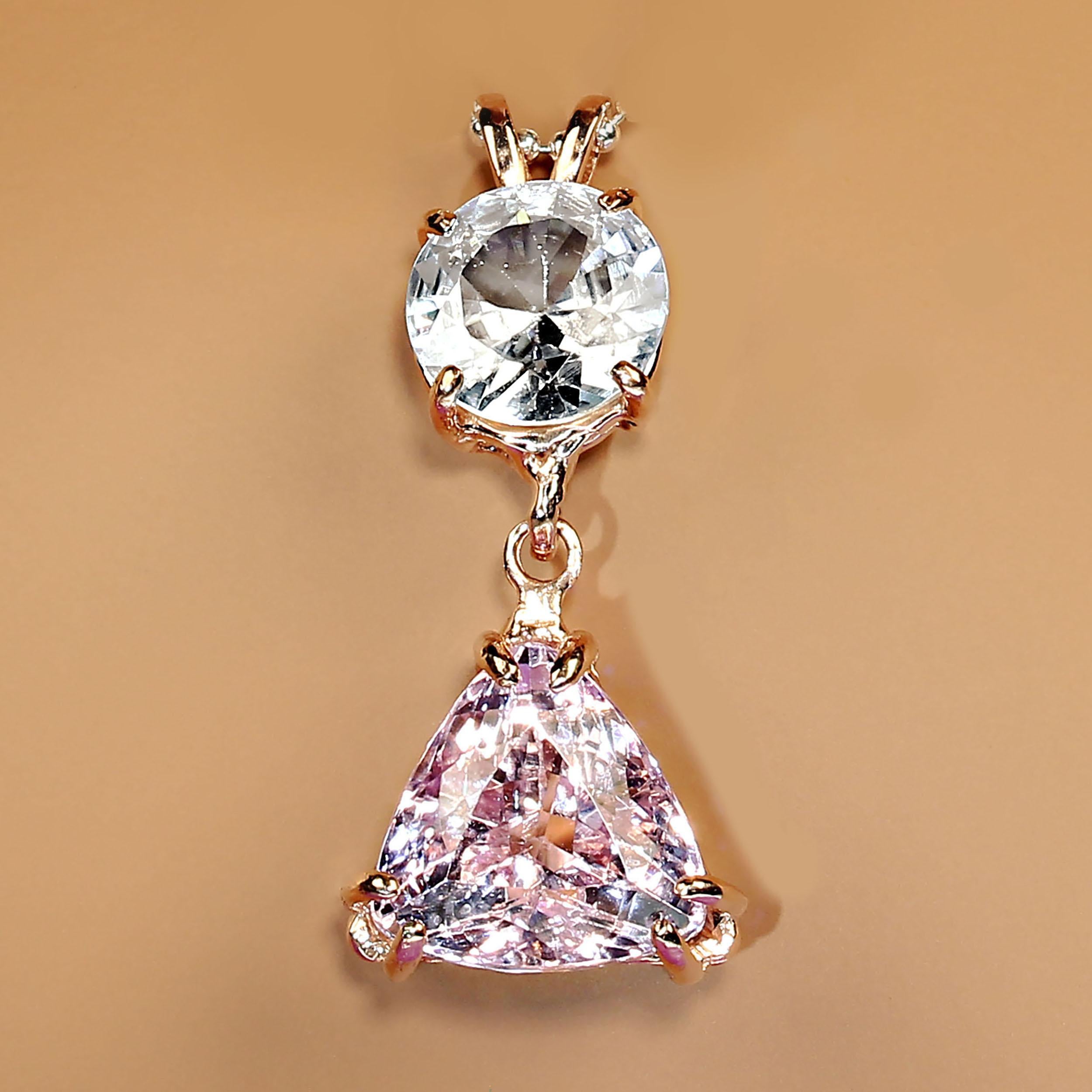 Stunning, elegant 14K rose gold pendant featuring a 3 carat genuine round Cambodian Zircon and a sparkling pink triangular 6.30 carat Kunzite. These are gorgeous gemstones and are a delight to wear.  The pendant is just over an inch in length.