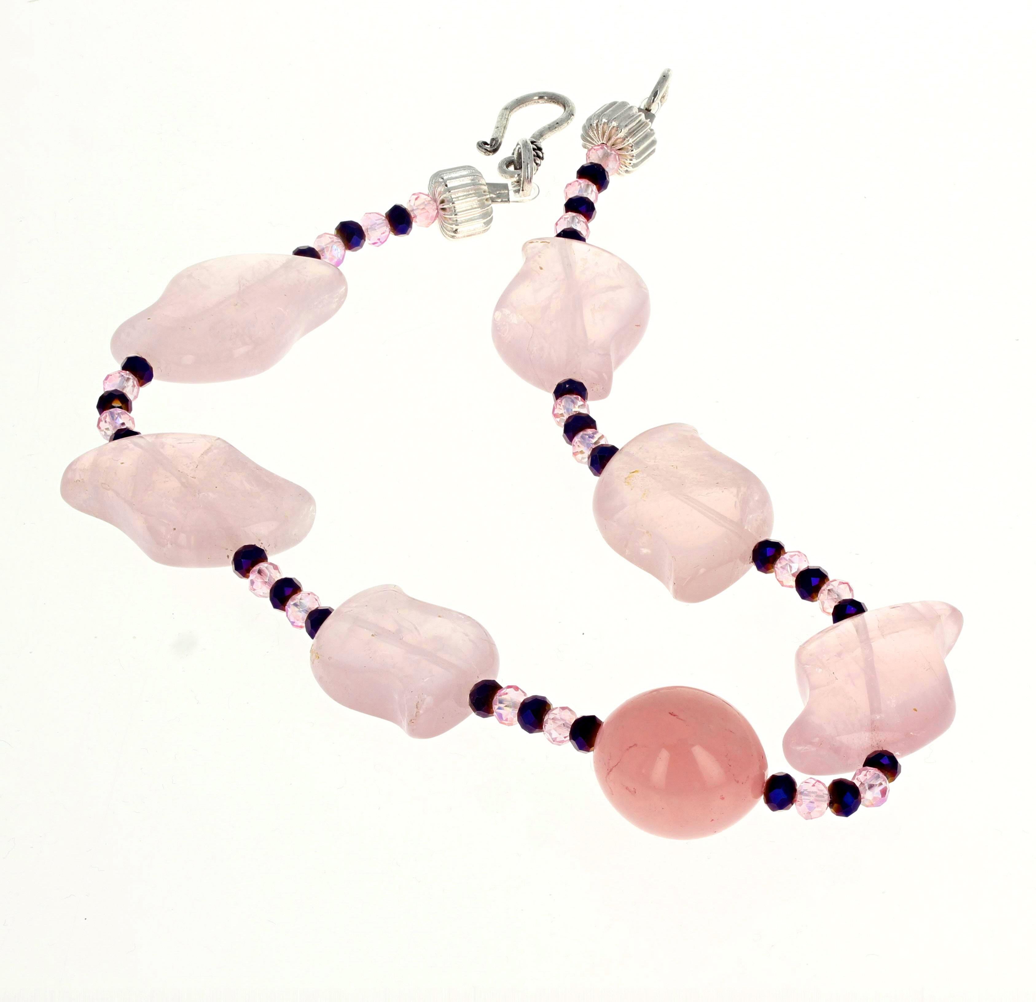 This lovely highly polished artistic pink Quartz (approximately 25mm x 18mm) is enhanced with gem cut sparkling little pink Quartz and natural real purple amethysts in this lovely  13 1/2 inch long necklace.  The clasp is a silver easy to use hook