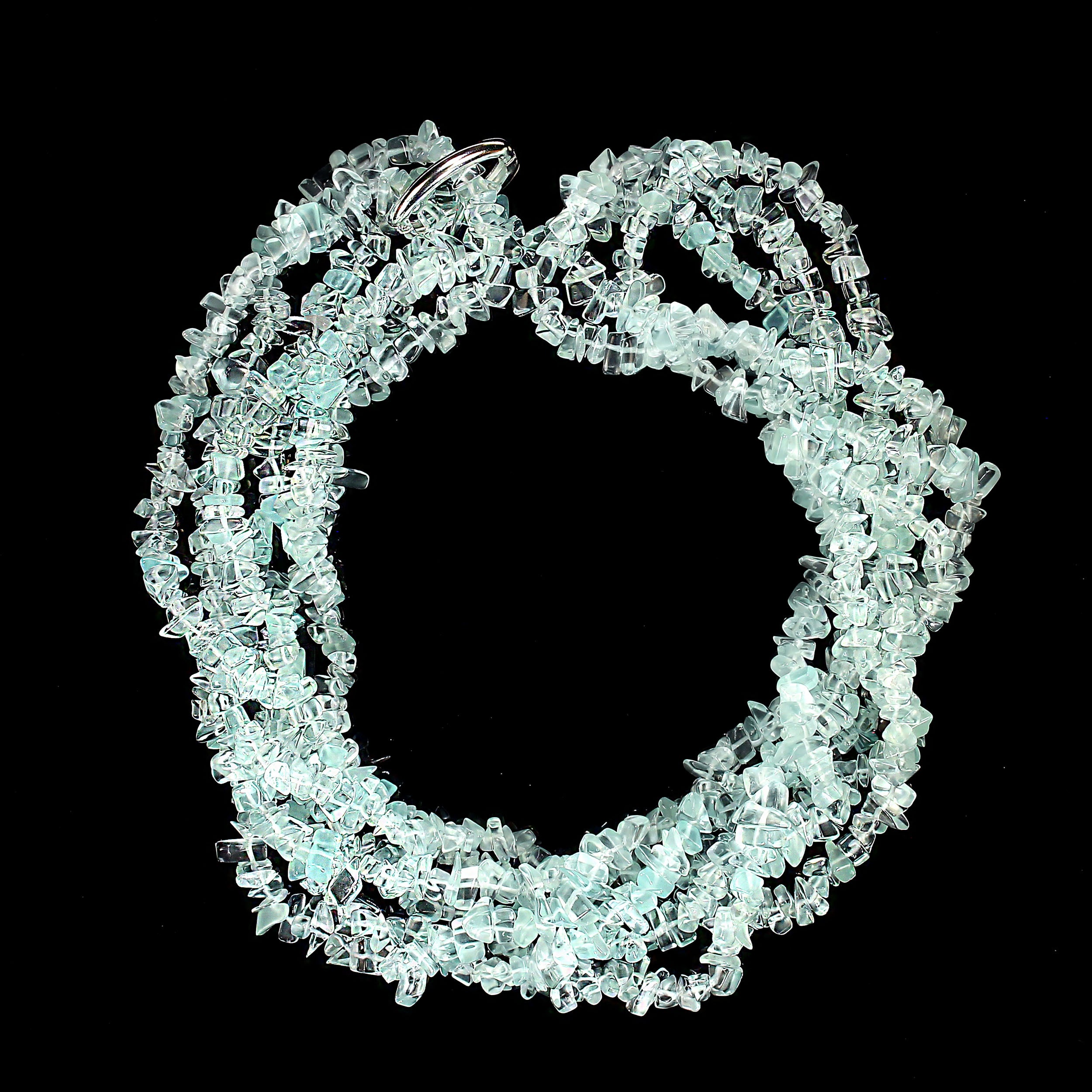 This is a beautiful set of three 33-inch infinity-style beaded necklaces in a refreshing aqua color. Each strand features a mix of highly polished translucent and transparent beads, creating a luminous, water-like shimmer that catches the light