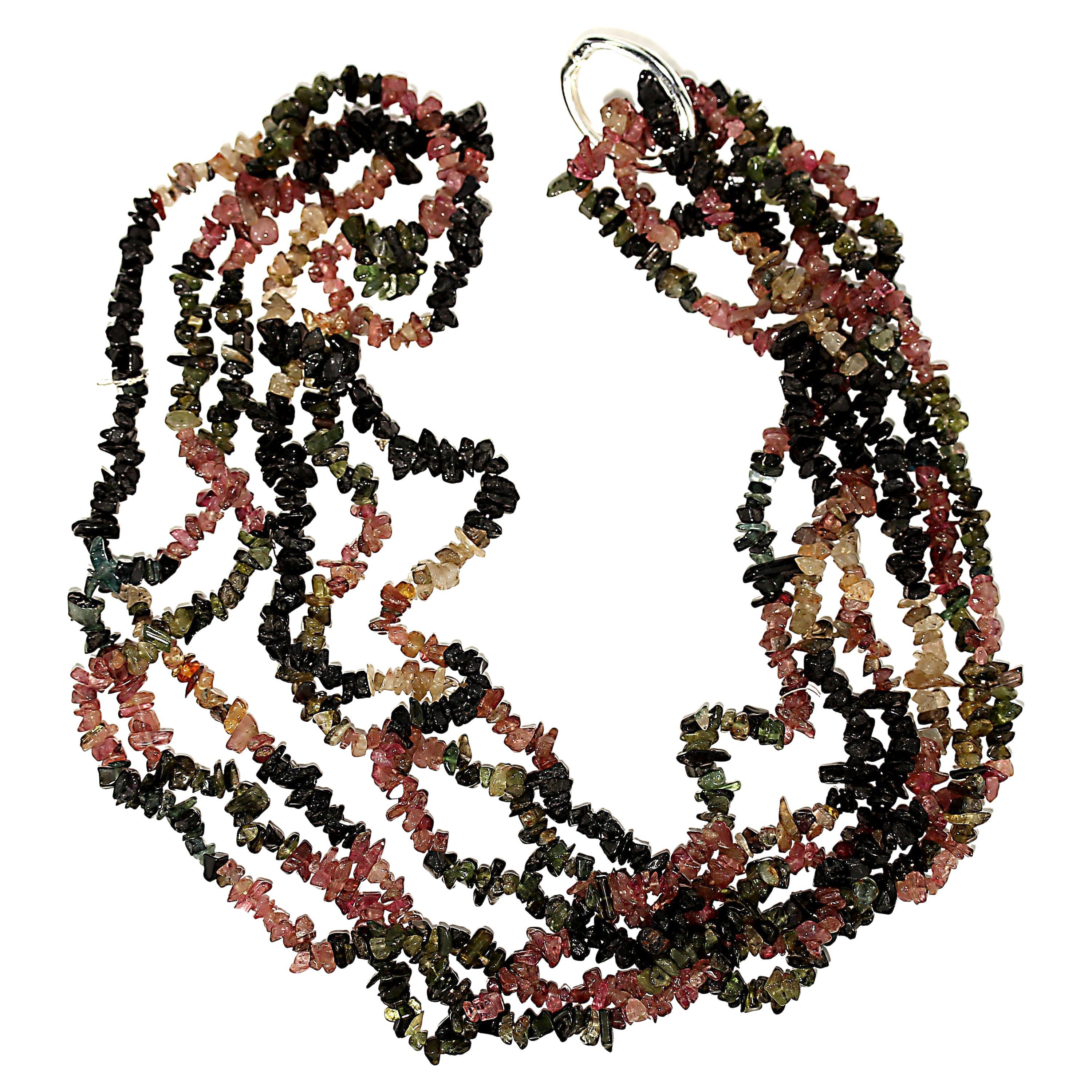 Discover the beauty and versatility of this stunning 34-inch Continuous Multi-Color Tourmaline Chip Necklace. With its endless styling options, you can wear it long, double it for a layered look, secure it in the back with a silver-tone clasp, or
