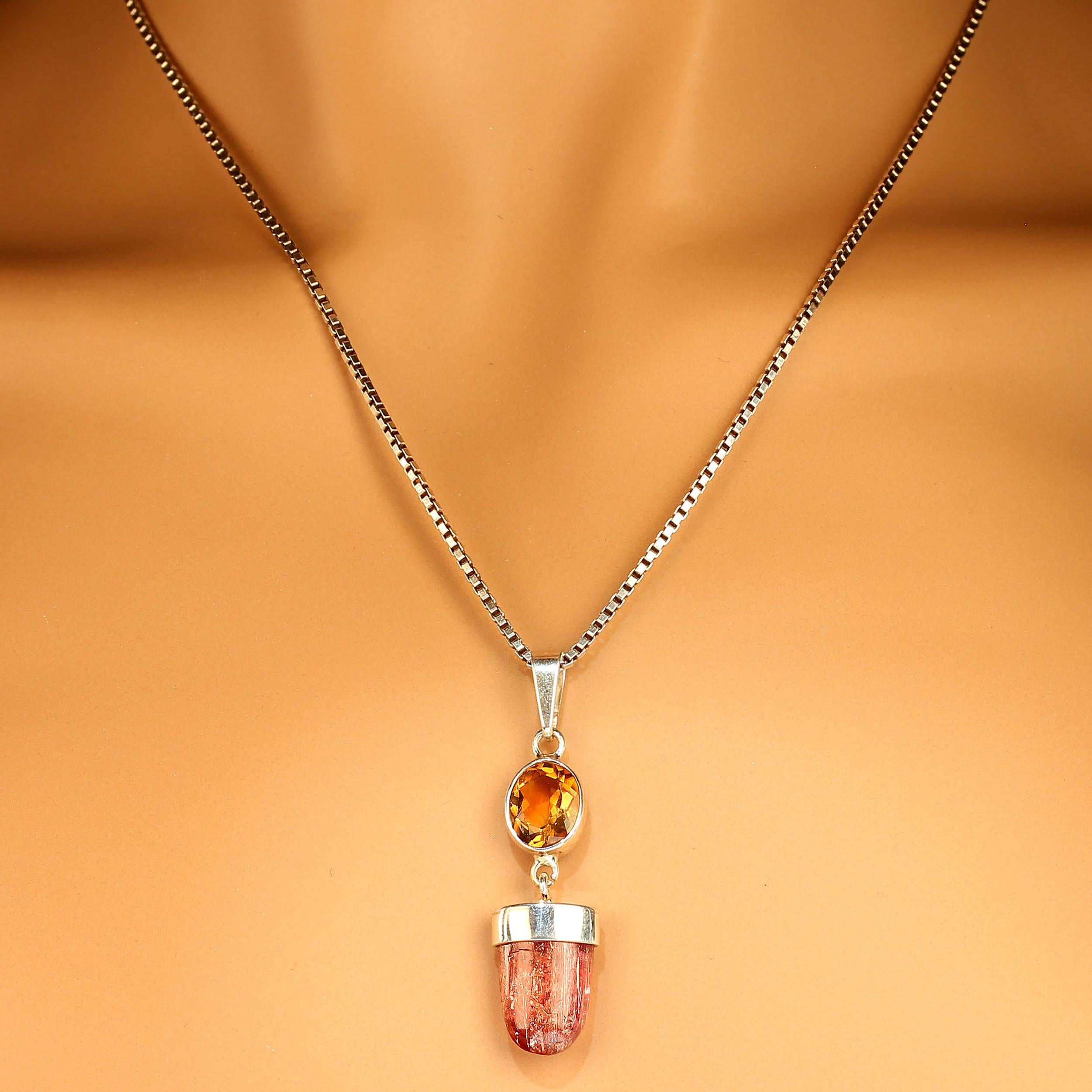 One of a kind pendant of 2.35 carat oval golden Citrine with a smooth bullet shaped Imperial Topaz hanging from it.  These are beautiful Brazilian gemstones selected from one of our favorite vendors in Belo Horizonte, Minas Gerais, Brazil, and set