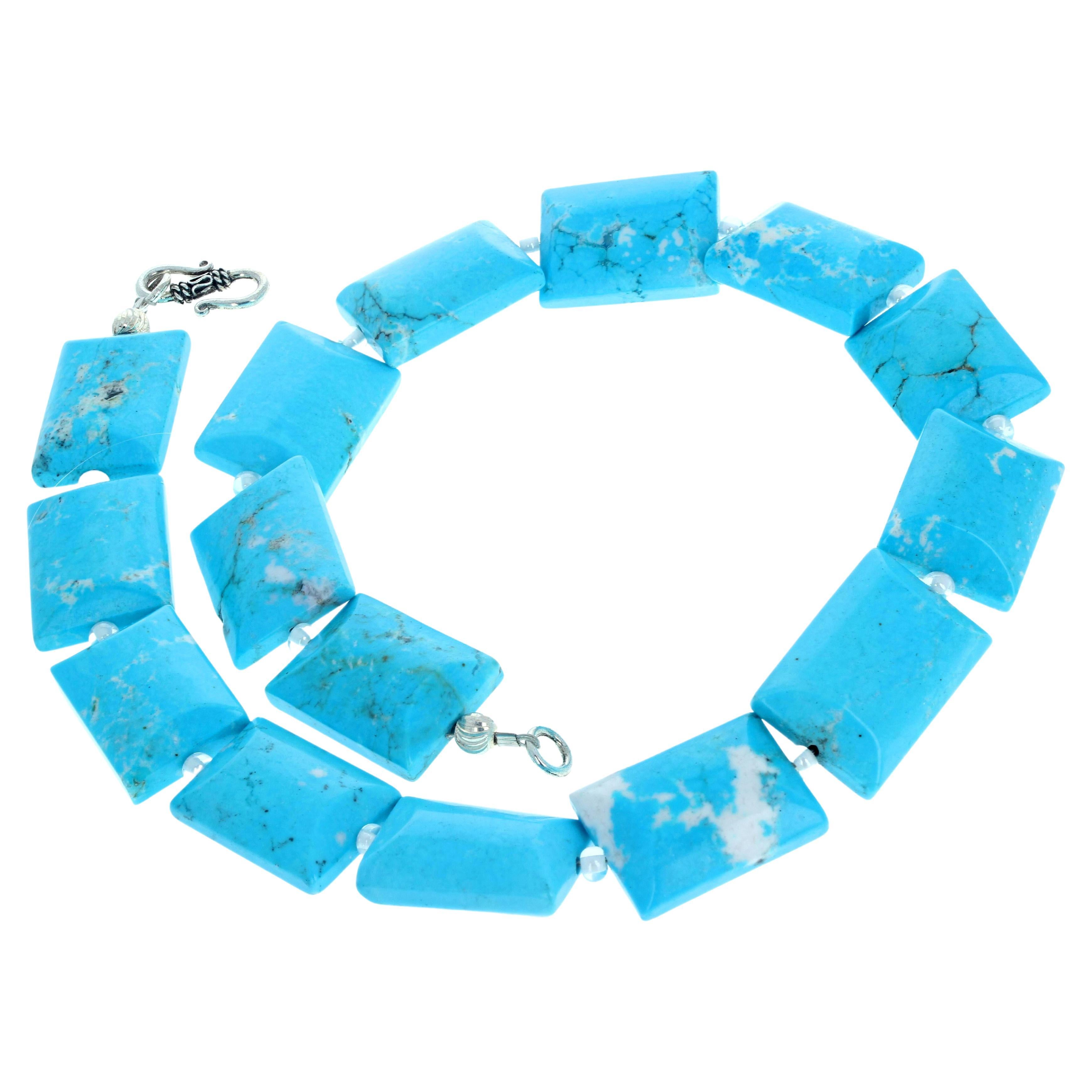 This fascinating artistic natural blue Magnesite turquoisy color necklace is lightly enhanced by sparkling little bright crystal beads.  The necklace is 19 1/2