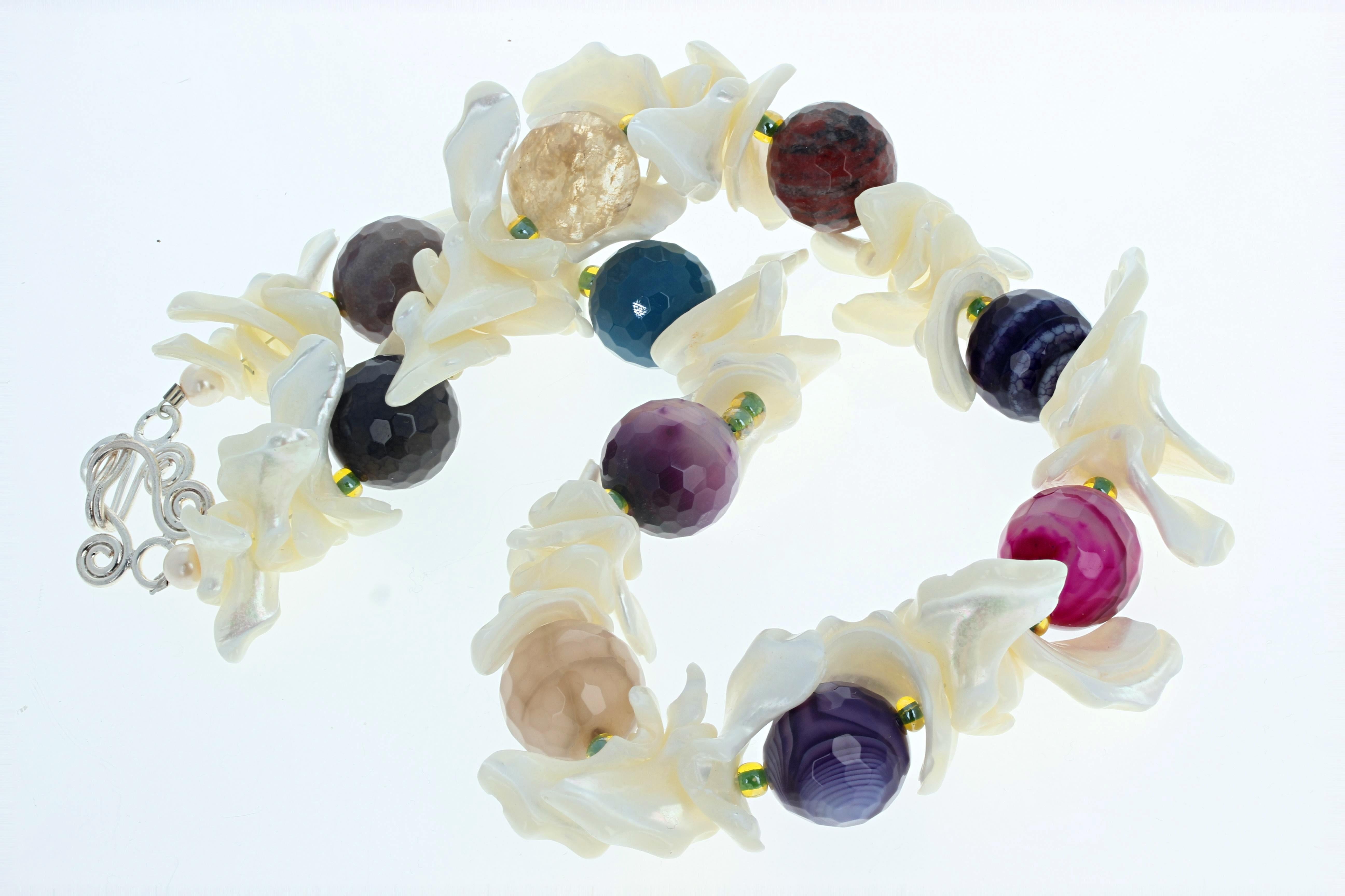 This necklace is Wow !  Beautiful polished natural Mother of Pearl Shells surround these glowing real Agates in this 18 1/2 inch long necklace.  The gorgeous highly polished gem cut Agates are approximately 18mm.  The clasp is an easy to use silver