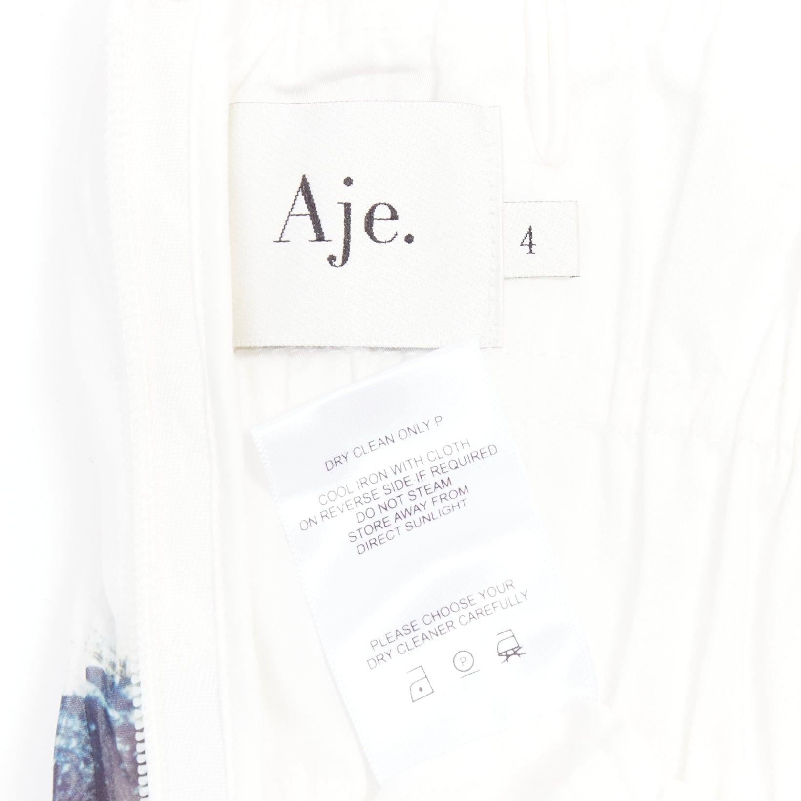 AJE Celestial mini abito plissettato bianco multicolore con stampa astratta a vernice UK4 XXS in vendita 3