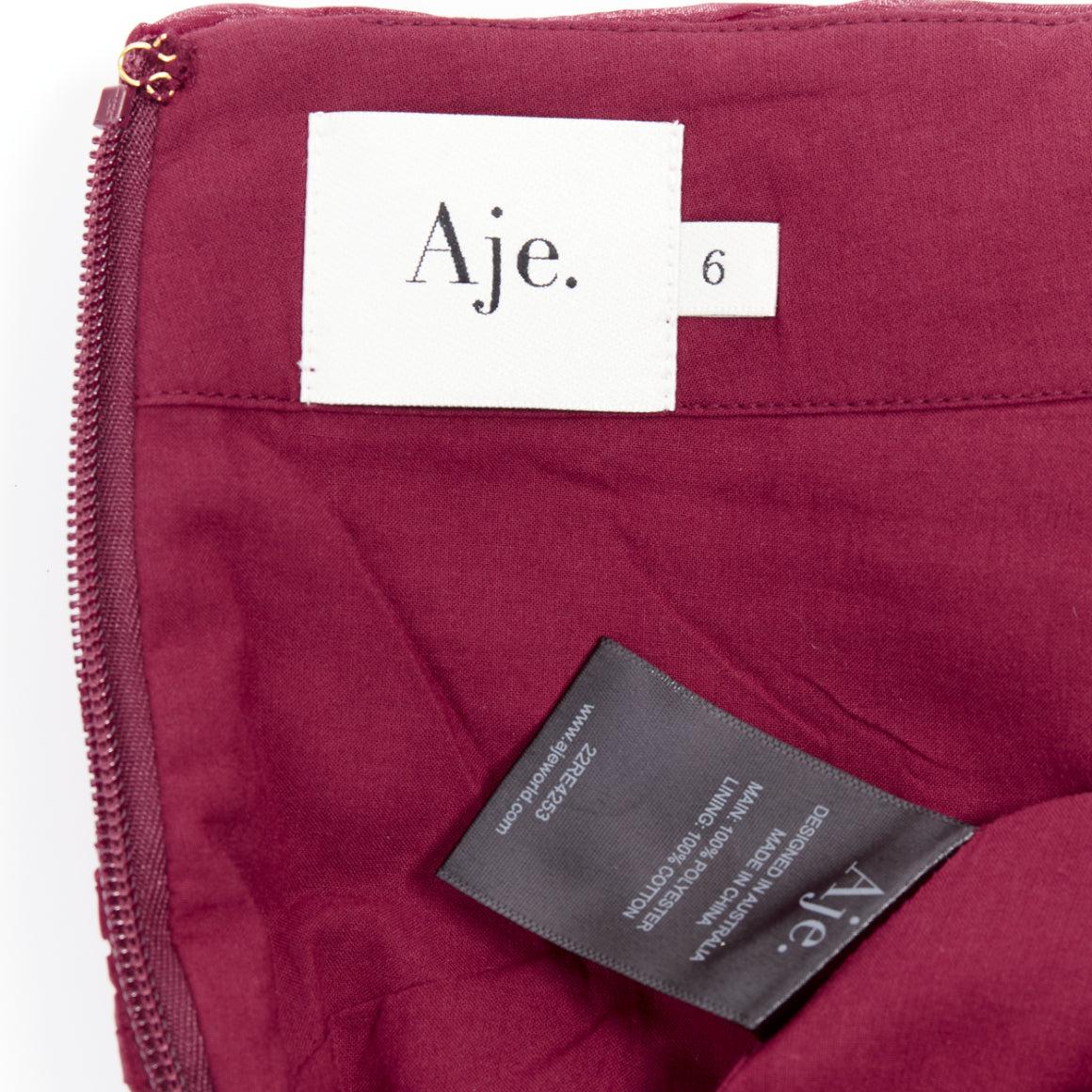 AJE Laurier Wave minifalda de cintura alta de organza plisada burdeos UK6 XS en venta 3