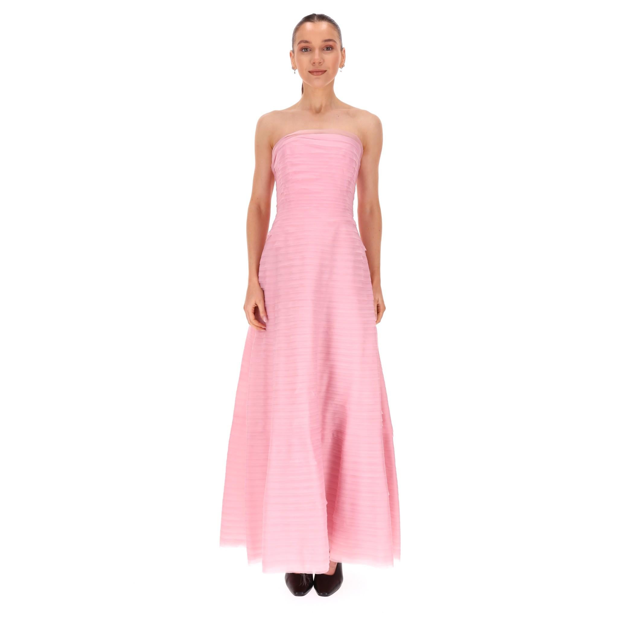 Aje Soundscape Strapless Layered Chiffon Gown

Maxi dress designed with delicate layers of baby pink fabric textured from the neckline to the hem.

Featuring horizontal organza frills throughout and fitted bodice with internal boning.

Voluminous