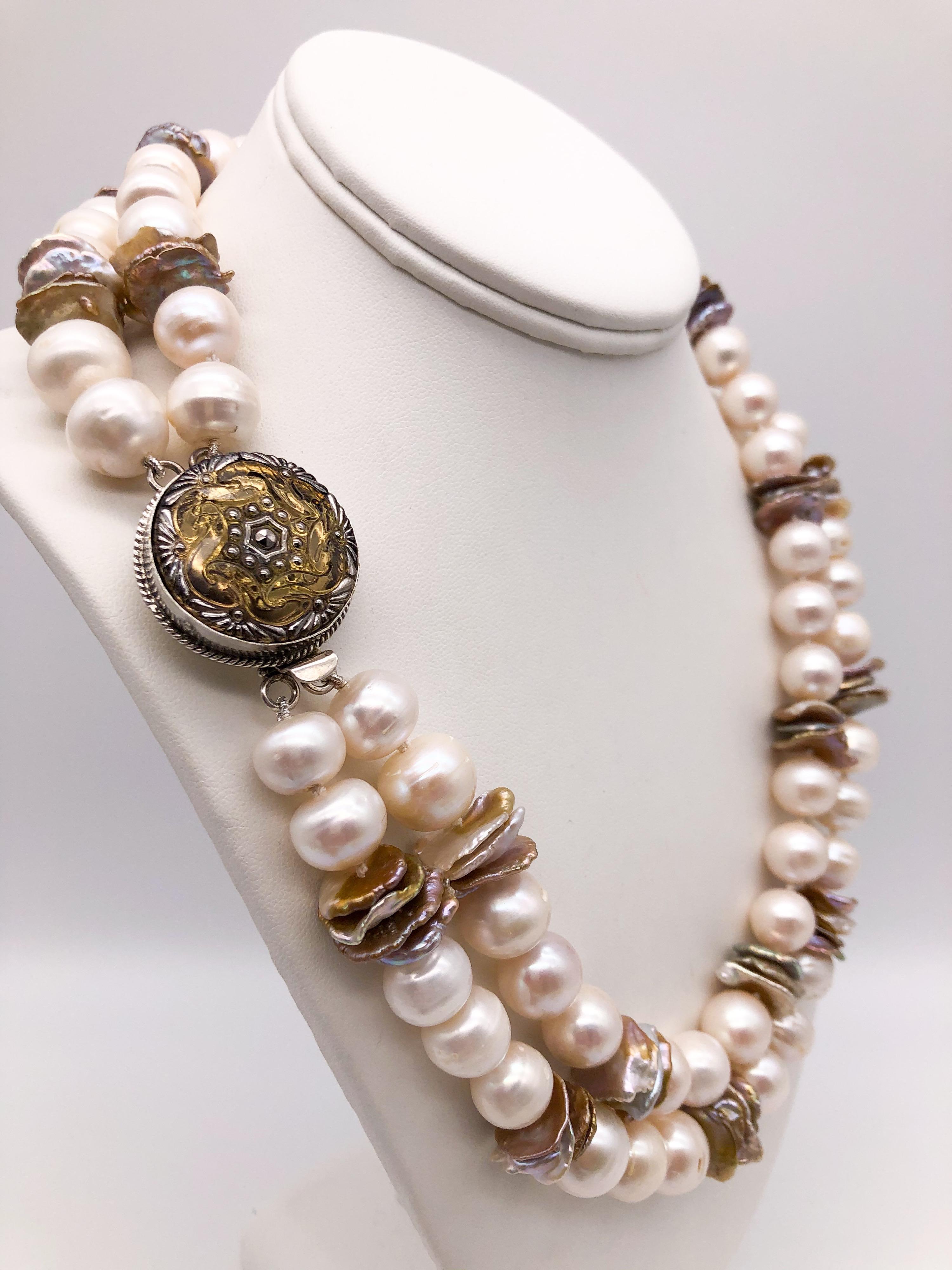 One-of-a-Kind
The lustrous white pears are separated by a series of 3 and 4 bead stacks of center drilled bronze Keshi pearls acting as spacers. The addition of the Keshi spacers adds a 
lovely textural quality to this opera-length necklace. Setting