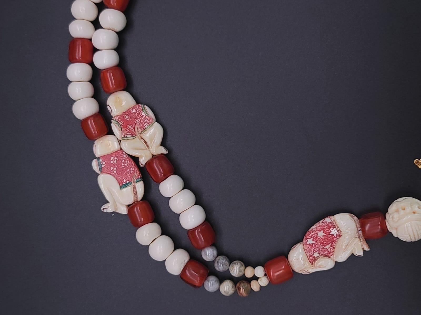 A.Jeschel 3 Wise monkeys in a Long Red Copal necklace 4