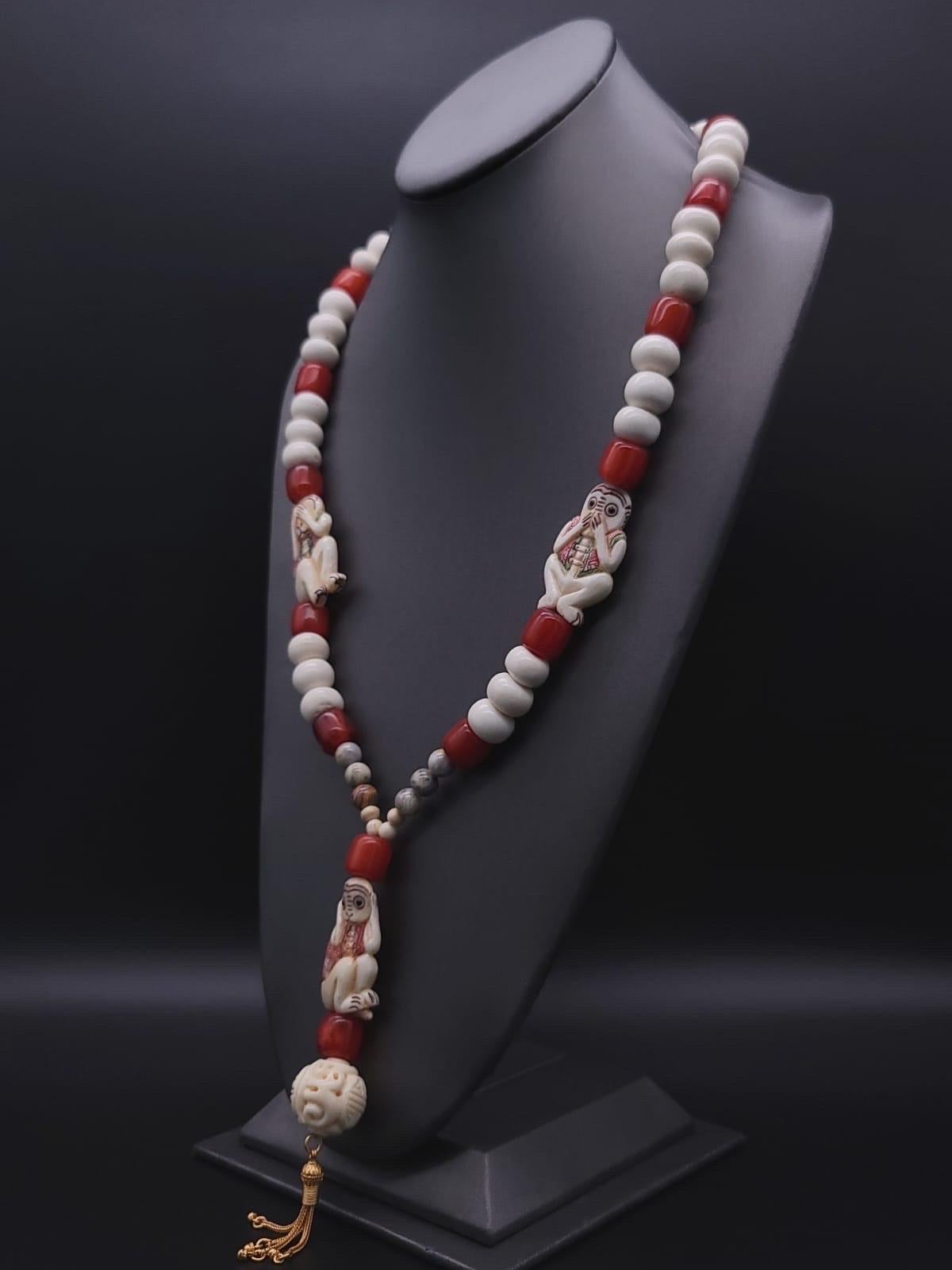 One-of-a-Kind

A popular maxim since the 17th century these 3 wise monkeys were on to something. This light-hearted necklace of Red copal ( younger amber) and carved ox bone monkeys anchored by a  longevity bead as well as a vermeil tassel. The