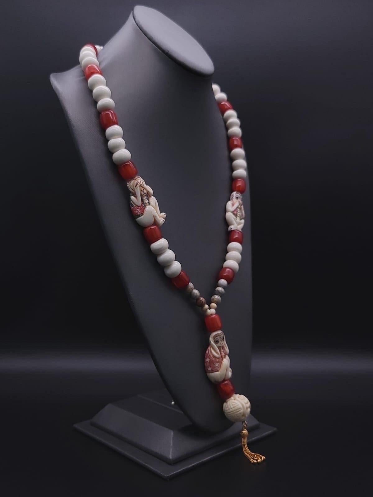 Contemporary A.Jeschel 3 Wise monkeys in a Long Red Copal necklace  For Sale